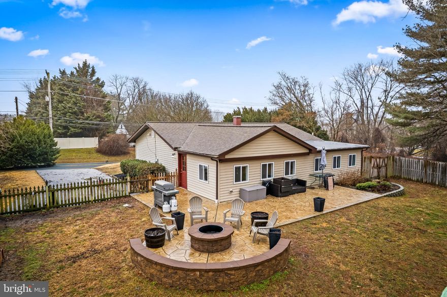 Freshly painted and move-in ready, this 3-bedroom, 2-bath ranch-style home offers comfortable main-level living along with numerous thoughtful updates inside and out. The main level features a bright and inviting layout highlighted by an Anderson triple-glass bow window that fills the living space with natural light, along with updated front and side entry doors. The living room features hardwood flooring and flows into an open kitchen with a granite breakfast bar/island, stainless steel appliances, and breakfast nook/table space. Just off the kitchen is a cozy sunroom/family room, providing the perfect spot to relax and enjoy views of the backyard.

Major exterior improvements include a roof with ¾" wood sheathing and 30-year architectural shingles, along with new soffits and gutters, providing both durability and curb appeal. The driveway has also been refreshed with three new inches of blacktop, adding to the home's well-maintained exterior.

Step outside to a beautifully designed fenced backyard retreat, perfect for relaxing or entertaining. Enjoy the stamped concrete patio with a stone fire pit and sitting wall, surrounded by updated landscaping that includes rock borders around a dogwood tree and retaining walls in both the front and rear of the home.

Recent mechanical upgrades offer peace of mind. In 2023, the home received a new well pump, water treatment system, pressure tank, and hot water heater. In 2024, the basement foundation was professionally waterproofed, a sump pump was installed, and the lower level was improved with new drywall, carpet, paint, and Thompson Creek windows. Storm drains in front of the windows were also replaced for added protection. The finished basement also includes a recreation room, providing additional space for entertaining, hobbies, or relaxing.

With extensive updates, a welcoming outdoor living space, and a freshly refreshed interior, this home is ready for its next owner to move in and enjoy.