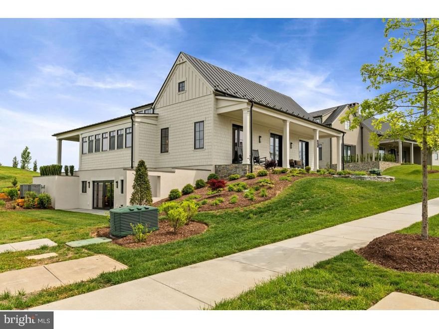 Magnificent home completed in June 2024, ready for immediate occupancy in Middleburg's most prestigious community, the Residences at Salamander. Nestled in the heart of horse and wine country, Residences at Salamander is a curated collection of just 49 estate homes set on the grounds of the acclaimed 340-acre Salamander Resort in Middleburg. As a resident, you have access to all resort amenities (pool, spa, tennis, fitness center, pickleball and basketball courts, riding trails, stables, expansive lawns and firepits, a dedicated concierge exclusively for owners, room service, housekeeping, a true guest-like experience). Additionally, the HOA covers all lawn and exterior maintenance including snow removal. This lot, 610 Martingale Ridge Drive is a highly coveted lot due to it backing up to extensive common area and dedicated green space on the western side of the home so no homes can be built in the rear or to the left. The home showcases true luxury resort living with multiple high-end upgrades set within a pastoral landscape and a Blue Ridge Mountain backdrop. Just beyond your doorstep is the village charm of historic Middleburg a mere minutes away. This home is the Huntbox model. It features an open floor plan and maximizes windows and doors for extensive daylight. On the main level is a welcoming foyer leading to the owner's suite which features a vaulted ceiling, French doors opening to a covered porch, a 14' long luxurious bathroom and custom 10X12 walk-in closet. On the east side of the foyer is a dramatic office with vaulted ceiling, fireplace and French doors opening to covered porch. To the north is a massive great room with vaulted ceiling featuring a wall with 26' of glass. The kitchen is spectacular, showcase w/high design and numerous upgrades including a built-in sub-zero refrigerator, wolf appliances, upgraded quartz, an 8' long custom lighting fixture above a 15-foot island and a walk-in pantry. The mudroom/laundry room has a 10-foot custom bench with storage, custom cabinets surrounding the washer/dryer, including two closets designed specifically for shoe storage and a oversized modern half bath with a large coat closet.  There is over 1000 sf of bluestone-covered porch area. The lower-level features two oversized bedrooms with ensuites and walk-in closets. One bedroom has French doors leading to a blue stone patio. There is a second great room on the lower level and a second office area with French doors leading to the patio. This home has been upgraded to include a detached one-car garage. Owner added an additional five closets strategically placed in the home for maximum storage. There is a climate controlled, 12X14 area in the lower level that is unfinished, presently used for gym equipment. This home was professionally designed and furnished with high-end custom pieces. As priced, the home is offered unfurnished but owner will sell the home furnished if buyer is desirous of a turnkey experience.