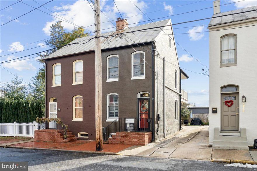 Welcome home to this charming and updated row home in the heart of downtown Frederick! Boasting 2 bedrooms (one is a traditional walk-through), and 1 bathroom, this residence seamlessly combines modern amenities with classic charm. Step inside to discover beautiful hardwood floors that grace the main and second levels, creating a warm and inviting atmosphere. The updated kitchen is a culinary delight, featuring ample cabinet space, upgraded countertops, and top-of-the-line appliances – perfect for the home chef. Entertain guests in the cozy dining room, ideal for hosting dinners and creating lasting memories. Relax in the beautiful living room space where the current owner has installed soundproofing between this home and the one next door. Two bedrooms on the second level offer cozy retreats, with access to a private balcony for a breath of fresh air or morning coffee. This home also comes with the convenience of a driveway, providing off-street parking at the back – a coveted feature in downtown living. The modern comforts extend to the mini-split A/C and heat system, ensuring year-round comfort. Enjoy the vibrant lifestyle of downtown Frederick with its shops and restaurants just a short walk away. This is not just a home; it's a lifestyle upgrade. Don't miss the opportunity to make this gem your own! Live your bliss...
