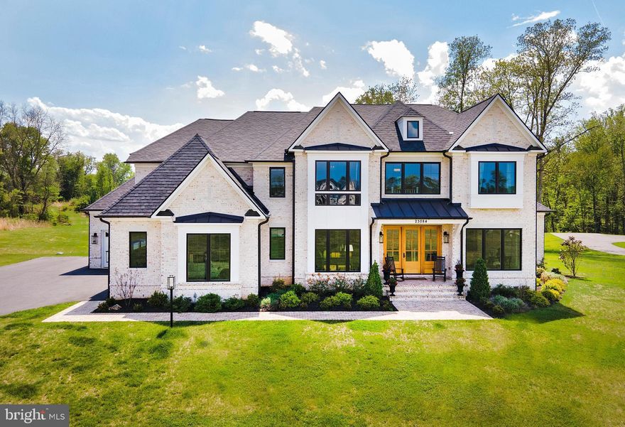 Want to build a custom home near Middleburg, but not wait for new construction? Welcome to Affirmed Park Court …a stunning French transitional home located just minutes from downtown Middleburg in Banbury Cross Reserve, an exclusive enclave of custom homes. Offering over 6,000 square feet of beautifully finished living space, this home was thoughtfully designed for today’s discerning buyer and is move-in ready. The floor plan includes 4 bedrooms with ensuite baths, plus the flexibility for a 5th bedroom and bath on the lower level, ideal for guests or an in-law suite. Privately sited at the end of a cul-de-sac, the premium lot enjoys protected views of fields and woods under permanent open space easement. Stone gate posts and a paved driveway lead to the all-brick residence with a deep front porch, mahogany entry doors, and designer carriage lighting. Inside, wide-plank white oak floors, soaring 10’ ceilings, and extensive custom millwork set the tone. Highlights include a formal dining room, private office, living room with built-ins, wet bar, and a dramatic family room with coffered ceilings and a floor-to-ceiling stone fireplace. The gourmet kitchen features Omega cabinetry, quartz countertops, a 12’ island, and premium Sub-Zero, Wolf and Cove appliances. The kitchen opens to the light-filled breakfast room with doors to the rear deck, complete with a gas-plumbing for a grill and automatic awning for outdoor entertaining. Upstairs, the luxurious primary suite offers a sitting room, dual walk-in closets, and a spa-like bath with soaking tub and oversized shower. Three additional ensuite bedrooms, plus a well-appointed laundry room with double washers and dryers, complete the second floor. The unfinished lower level offers abundant potential for recreation, fitness, a guest space and storage. Residents enjoy walking the community roads and the protected open spaces and easy access to Route 50, Dulles International Airport, and Washington, DC. Please see documents section for the extensive list of upgrades and custom features.