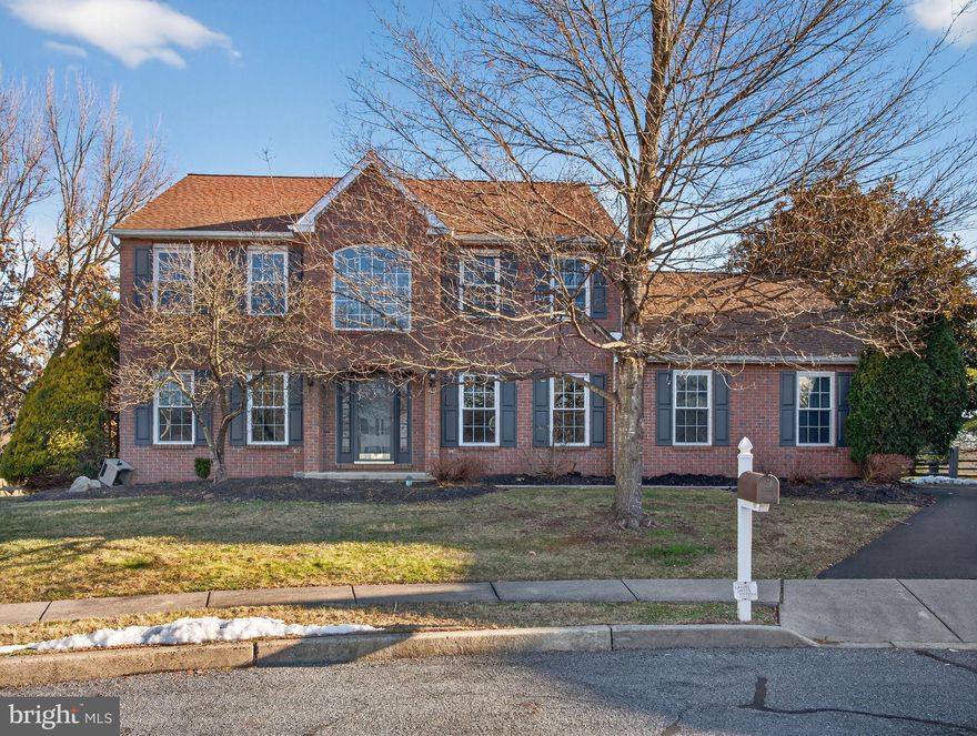 Located in the desirable Kingscote neighborhood and set on a quiet cul-de-sac, this brick-front colonial offers a comfortable balance of space and livability. With four bedrooms and 2.5 baths, the home features generous room sizes and flexible living areas throughout. Step into a two-story foyer filled with natural light and hardwood floors. The spacious eat-in kitchen offers granite countertops and ample cabinet space. A large main living area features outdoor access and a bright picture window, while the formal living and dining rooms provide additional space for entertaining. Upstairs, the primary bedroom includes a sitting area, walk-in closet, and full bath with a soaking tub. Three additional well-sized bedrooms and a full hall bath complete the second level. The large open basement offers additional storage and the opportunity to finish if desired. Outside, the generously sized fenced backyard is ideal for entertaining or everyday enjoyment. Conveniently located near shopping, dining, and everyday amenities, this home combines a desirable setting with easy access to what you need. Schedule your tour today.