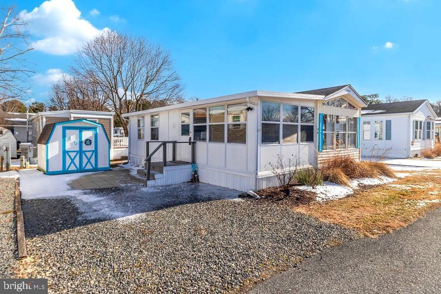 White Horse Park boasts an ideal waterfront location just minutes from Ocean City, with the resort area’s most affordable vacation and investment properties!  So much has been updated in this fully furnished, turn-key cozy getaway, including the kitchen, bathroom, flooring, furnishings, 2 new insulated windows and a brand new ductless mini split heat pump. You'll love the "beach inspired" decor, including a large lighted central Tiki Bar AND a breakfast bar! All rooms are nicely sized.  One bedroom has a queen sized bed, and the other has 2 trundle beds.  Attractively landscaped with knock-out roses, rosemary and lavender.  Store all of your beach gear and bicycles in the storage shed, adjacent to the comfortable paver patio.  Expecting extra guests?  A foot-path gives you a short-cut to the bath house & laundry,  just steps away!  The convenient location allows for a short walk to the well-kept amenities of White Horse Park, where you own the land and never pay ground rent! Includes a secured gate entry, large swimming, pool, marina, boat ramp, crabbing  pier, fenced boat storage, picnic area, playground, bath houses, and laundry areas. The low HOA fee includes water/sewer, lawn maintenance, trash removal, and much more. Some occupancy restrictions apply during the off-season.