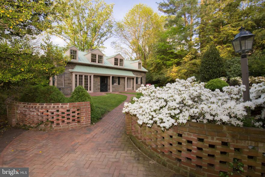 "Hollowood," a miniature estate in Chestnut Hill, is a picture from a storybook. Wonderful collection of three lovingly restored 19th century out-buildings nestled on a breathtaking 3 acre hillside riven by a whispering brook. Enchanting gardens with a delightful combination of manicure and naturalism provide an incredible setting for open-air entertaining. Main residence is a carefully restored carriage house with custom woodwork crafted to match the period of the original details. Total square footage of main residence is 2,538 sq. ft.  Main level features a large living space with fireplace, balcony, exposed beams, and wide plank floors, as well as library, dining room with exquisite built-ins, kitchen, and powder room. The upper level offers the master suite with 2 Juliet balconies overlooking the gardens, 2 full baths and an additional versatile living space. The lower level bedroom has an en suite bath and glass doors leading to a stone terrace and fountain. Spacious second residence, featuring library with skylights, kitchenette, bedroom and 1  baths, offers space for guests or opportunity for passive income. Total square footage of the second house is 2,070 sq. ft.Greenhouse studio with reflecting pond & wood stove is perfect for an afternoon retreat or warming up between sledding runs. Eleven flagstone and brick terraces dotting the landscape provide ideal lookout points from which to enjoy the magic of "Hollowood." This peaceful retreat is within walking distance to the village of Chestnut Hill and offers quick and easy access Center City Philadelphia and New York via rail.