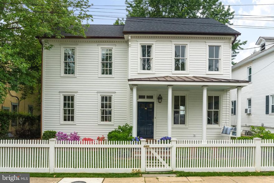 Nantucket meets Martha's Vineyard in this exemplary renovation, completed in 2017. A cut above the standard Eastport homes. This home was re-built with high quality finishes and attention to detail. Entering the home, you are greeted by a gas-lit copper lantern. A wooden swing hangs at the edge of the front porch inviting you to sit and enjoy the peaceful setting. High-end paints and wall coverings are throughout the home. The German Lap siding was custom milled to replicate the original 1920 s profile. Wide-plank white-oak hardwood flooring with a subtle white-wash creates an elegant coastal feel. Tall ceilings over 9  feature beautiful crowned white molding. Full masonry fireplace and chimney. Honed white Carrara marble kitchen with shiplap decor. Full suite of Subzero appliances with 2 dishwashers and 6-burner, dual fuel Wolf Range. Kitchen pantry with storage, coffee bar and beverage center. Generous window light in this home, with kitchen views of the large rear yard and carriage house. Carriage house includes renovated, 2-car garage. Brick patio and brick path leads to an all-cedar fence and a white stone driveway which can hold up to 5 cars in addition to the garage bays. The carriage house features a home office over the garage, balcony for entertaining, kitchenette, family room and full bath. Second floor of main home offers four bedrooms with 3 full baths, plus a third floor play area or home office and attic storage. All bathrooms feature marble tile and vanity tops. Charming details abound, including barn-doors, a hidden storage cabinet and a hidden step stool in the Jack & Jill bath. If you are seeking quality beyond the ordinary with easy access to restaurants, shops, yacht clubs, marinas and more, this home will impress you.