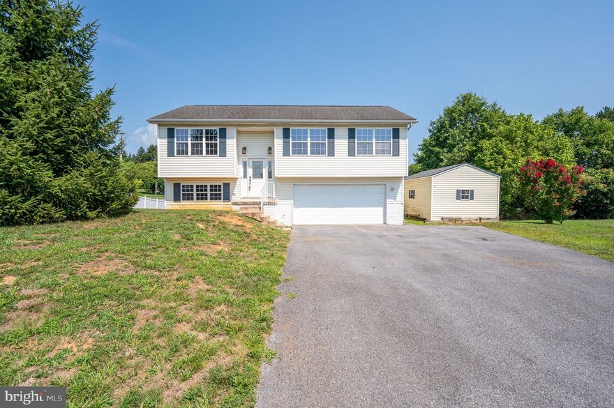 Come see this 3 bedroom, 2.5 bathroom split foyer in the sought after Fort Hill Farms! On an approximate  .41 acre lot - create your dream backyard oasis! The living space is a split concept with both open and private settings. The living room and dining room provide an open concept for the best entertaining options. The kitchen offers stainless steel appliances, white cabinetry, double sinks, hard surface flooring and granite counter tops. The master bedroom offers a cozy space with an en suite bathroom. Two other secondary bedrooms are on the main floor. All rooms offer laminate flooring for ease of cleaning. The finished basement could be used for an additional living space, rec room, craft area or a playroom! The 2 car garage has built in cabinets and counter tops for maximum usage of the space. Seller had all nail holes patched for ease when you choose your paint colors. (Displayed in pictures) Carpet on stairs were removed by seller, but can be easily painted and/or have flooring of your choice laid. With a little TLC- this home will make a great home for years to come!