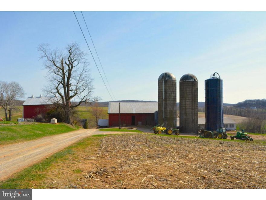95 Acre Dairy farm with 62 tillable acres, 4 pasture acres, 25 woodland acres, 4 building acres. Has a 45x63 76 Stall Dairy Barn with hay storage above. 14x72 Heifer barn slatted floor with small pit. 17x13 Milk House, 37x43 Bank Barn, 39x20 Out Building, 23x58 Equipment Shed, 2x 20x60 Silo Concrete, 20x60 Silo Harvestore, a 1500sq.ft 2 story farmhouse and a 732 sqft rancher.