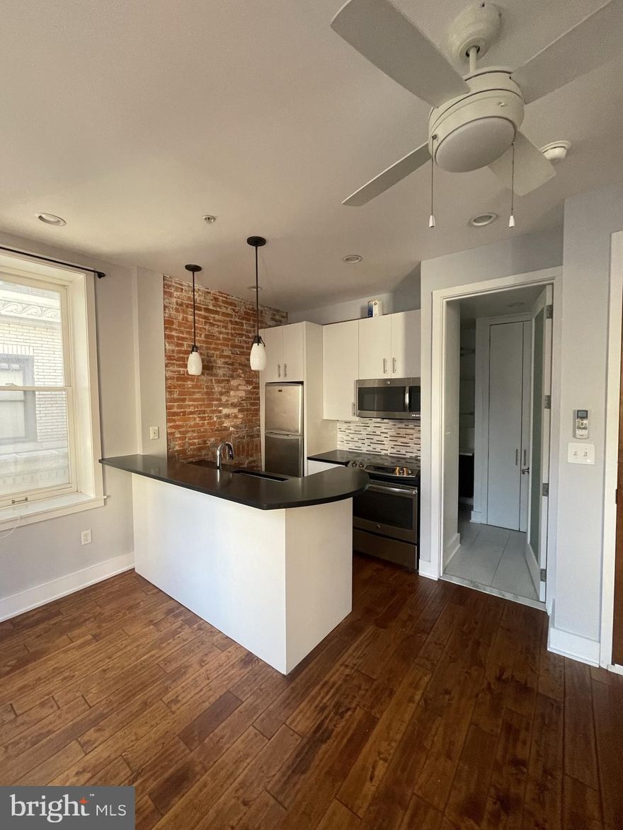 Modern studio, one half block from Rittenhouse Row! This home features an open kitchen with contemporary white cabinetry, dark quartz countertops, designer tile backsplash, stainless steel appliances, and a breakfast bar. The modern bathroom has a sleek vanity and tub shower with designer tilework. There is an in-unit washer/dryer, hardwood floors, exposed brick, and recessed lighting throughout. 126 South 16th Street is a walk-up conveniently located one half block from Walnut Street shopping, less than three blocks from Rittenhouse Square and The Avenue of the Arts, and just two and a half blocks from the Market Street office corridor.