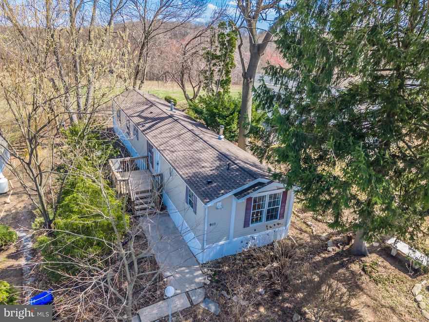 Beautifully remodeled and move-in ready, this 4-bedroom, 2-bath home at 911 Winesap Way offers updated, low-maintenance living in the sought-after Appleville community. Inside, you'll find granite countertops, a crisp subway tile backsplash, stainless steel appliances, and luxury vinyl plank flooring throughout. The open-concept layout seamlessly connects the kitchen, dining, and living areas, while the spacious bedrooms(two sets at either end of home)  provide flexible options for working from home, hosting guests, or creating your own personal retreat. Both bathrooms have been thoughtfully updated with modern finishes. The owner's suite offers a walk in closet with access to the owner's bath.  Outside, enjoy a manageable yard and off-street parking with a pathway to your own pond just waiting for you to finish it. Just minutes from both downtown West Chester and Downingtown, this location offers easy access to shops, restaurants, Route 202, and Highland Orchards for fresh produce and seasonal fun. Affordable and stylish, this home is ready to welcome its next chapter.