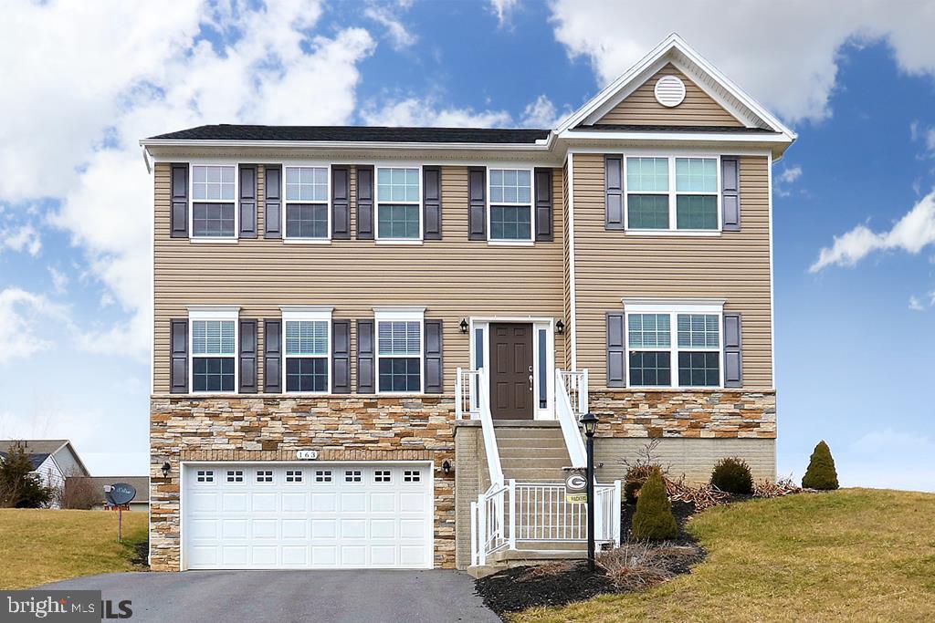 Precise, efficient, thoughtful design & beautiful, the best of everything has gone into this compelling 2-story. Maxed out with upgrades to include, 9 foot ceilings thru-out, recessed lighting, hardwood flooring covering the main floor, living room/office with French doors. The Chef's Envy kitchen boasts stainless appliance, Quartz countertops, island with storage & breakfast bar, butler's pantry adds additional convenience when serving guests in the formal dining room. The second floor delivers the ultimate owner's suite with a sitting area, oversized walk-in closet & private full bath with a dual vanity & walk-in shower. There are 3 additional nicely appointed bedrooms (2 with walk-in closets) another full bath & a handy 2nd floor laundry room with utility sink. Additional highlights include a rear composite deck, shed, unfinished basement & an integral 2 car garage. Country setting with stunning views of neighboring mountain ranges plus easy access to I99/I80.