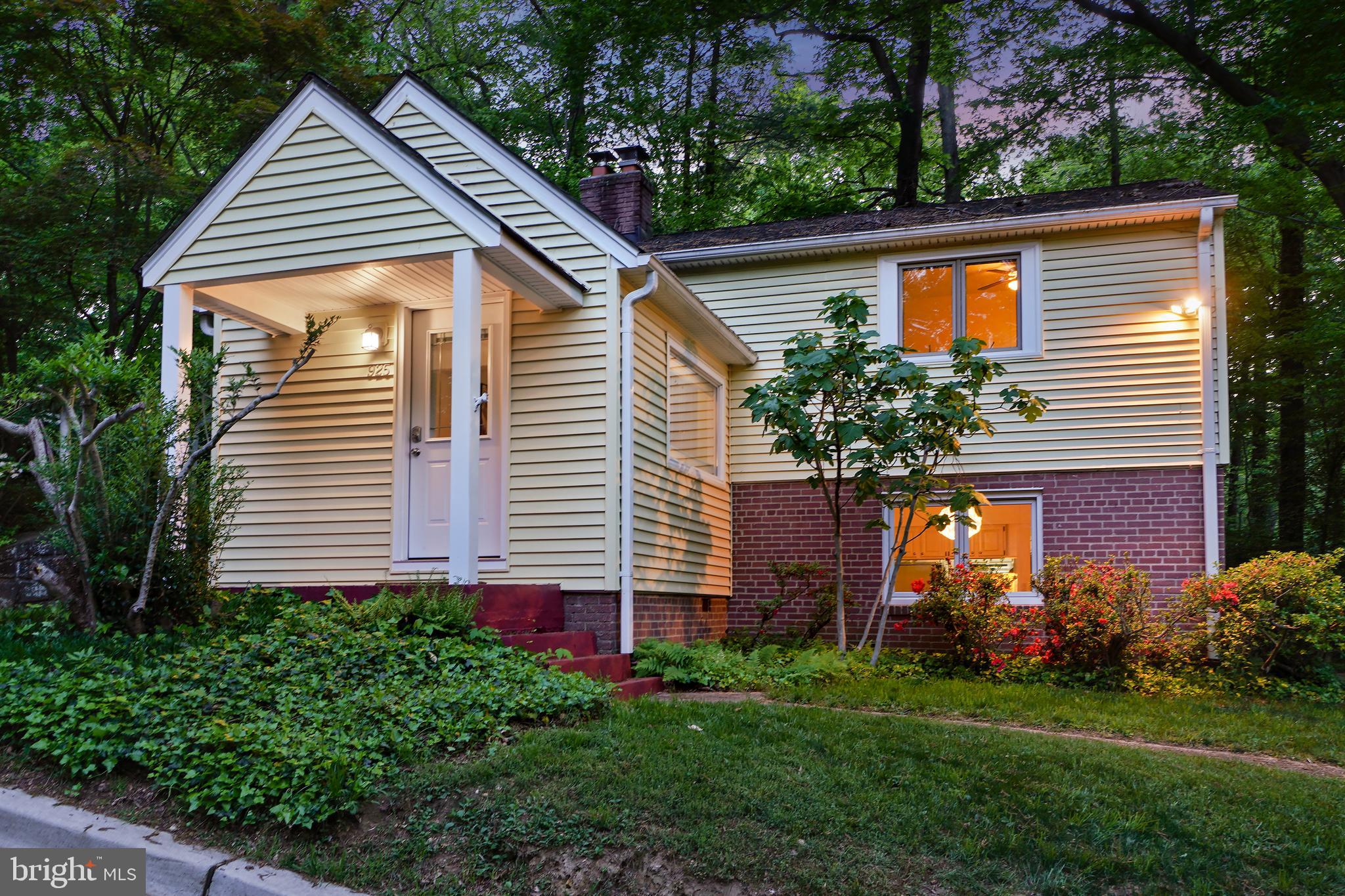 Enchanting, updated cottage perched overlooking Sligo Creek! This fairytale home features beautiful wood floors, replacement casement windows, and delightful built-ins — all set in a tranquil park-like setting. A charming covered front entry welcomes you into the sun-drenched living room, complete with a wood-burning fireplace flanked by custom display shelving. Just a few steps down, an open dining area flows seamlessly into the updated granite kitchen, which offers a breakfast bar, stainless steel appliances, ample prep space, and access to a pleasing back patio. This level also includes a convenient powder room, laundry/storage room, and cellar storage.
Upstairs, you'll find three bright bedrooms and a renovated full bathroom with elegant stone tile accents. The primary bedroom boasts a ceiling fan and two deep closets. The second bedroom features a built-in wood Murphy bed with integrated lighting, offering both style and functionality. The third bedroom includes built-in shelving, a large ceiling fan, and a private exterior side entrance.
The picturesque corner lot offers two parking areas, two patio spaces, a shed, and mature landscaping, including vibrant azaleas and a fruit-bearing fig tree.
Ideally located near Sligo Creek Park and its scenic trails, Sligo Creek Playground — perfect for outdoor recreation. Beyond the trail and its parks and playgrounds, you’ll be close to the Takoma Park Library, Community Center, and just over one mile from the Takoma Park Metro Station.
Experience the vibrant charm of Takoma Park, known for its sylvan setting, strong sense of community, local shops, restaurants, popular farmers' market, and entertainment options in both Takoma Park and downtown Silver Spring. This close-knit neighborhood is celebrated for its lively block parties, Halloween gatherings, and friendly meetups — making it a truly special place to call home!