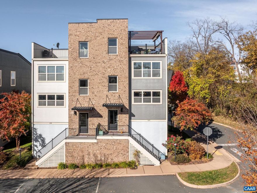 *OPEN SUNDAY, FEB 15th 12noon-2PM* Modern end-unit townhouse with panoramic mountain views and private rooftop deck overlooking Carter Mountain! Ideally located within walking distance to UVA, the Downtown Mall, coffee shops, and top Charlottesville restaurants, this contemporary city home offers the perfect blend of location and lifestyle. Open Great room with gas fireplace flows into an eat-in kitchen with abundant counter & cabinet space, center island, granite counters, gas cooking and a large pantry. The triple windows over the sink frames breathtaking mountain views and fills the space with natural light. The bedroom level features a primary suite with stunning views, walk-in closet and luxury bath with double sink vanity and glass-enclosed tile shower.  Two additional bedrooms, a full hall bath with a shower over the tub and convenient laundry complete this floor. Head up to the top level, pour your favorite beverage at the wet bar, and step outside to the fabulous rooftop deck with retractible covered pergola. The ground level offers a guest en suite which is nicely separated and perfect for guests, a home office, or flex room. Two car garage with work bench, cabinets and shelving for additional storage.,Granite Counter,White Cabinets,Fireplace in Great Room