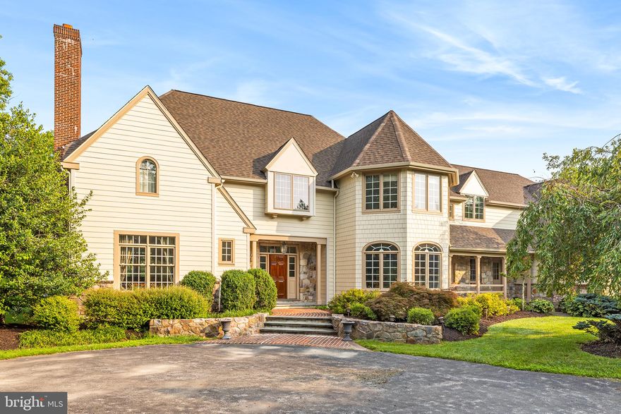 This property offers timeless quality construction (Norcini Builders) and is situated on lush 2.4-acre lot in an exceptional neighborhood and quiet cul-de-sac.  Outside, admire the hand cut stone and newer Hardie board siding.  There is a mix of mature plantings, flagstone & brick patios and plenty of driveway parking. 
Inside, admire the curved walls, custom moldings and exceptional floor plan perfect for everyday living and entertaining.  The foyer features front-to-back views and a grand staircase with a sunny and bright landing leading to the 2nd floor living quarters. From the foyer step through two archways to a large living room with gas fireplace, built-in shelving and French doors leading to an expansive sunroom with walls of windows overlooking the secluded rear yard. The dining room is grand and showcases a beautiful curved set of windows overlooking the horseshoe driveway and front gardens.  This room is the perfect setting for intimate dinners or large events with your favorite dinner guests.   Beyond the dining room, there is a butler pantry with a wine fridge, sink and granite countertops. This leads to the large gourmet kitchen with island seating, timeless off-white wood cabinetry and gas cooking.   The Kitchen is open to both the family room and breakfast room with vaulted ceiling.  Both rooms offer fantastic southern sun exposure all year round.  The family/great room features a stone wood burning fireplace, French door to rear yard and a back staircase to 2nd floor. To complete this level of living enjoy a large mudroom and side door entry, an expansive laundry room and an attached side load three car garage and two powder rooms.  The upstairs offers 5 full bedrooms with 3 full baths and a bonus great room/office area with built-ins and a large walk-in attic for storage.   Additionally, there is a 3rd floor walk-up attic perfect for more storage.   The lower level is full and offers two staircases either from the garage to utility access area or to the lower level from foyer.   The finish lower level features another family room  with stone hearth gas fireplace, full bar for entertaining, a full bath and an exercise room and a gaming area (pool table, space for ping pong or more). Simply put, the finished lower level offers a little something for everyone.  Lastly, 5 Mill Road is walkable to parks ( including Mill Park & Fox Hollow Trail)  and walkable to General Wayne Elementary.  This property is also conveniently located close to the Paoli Train Station and other routes of transportation. Schedule your appointment today!