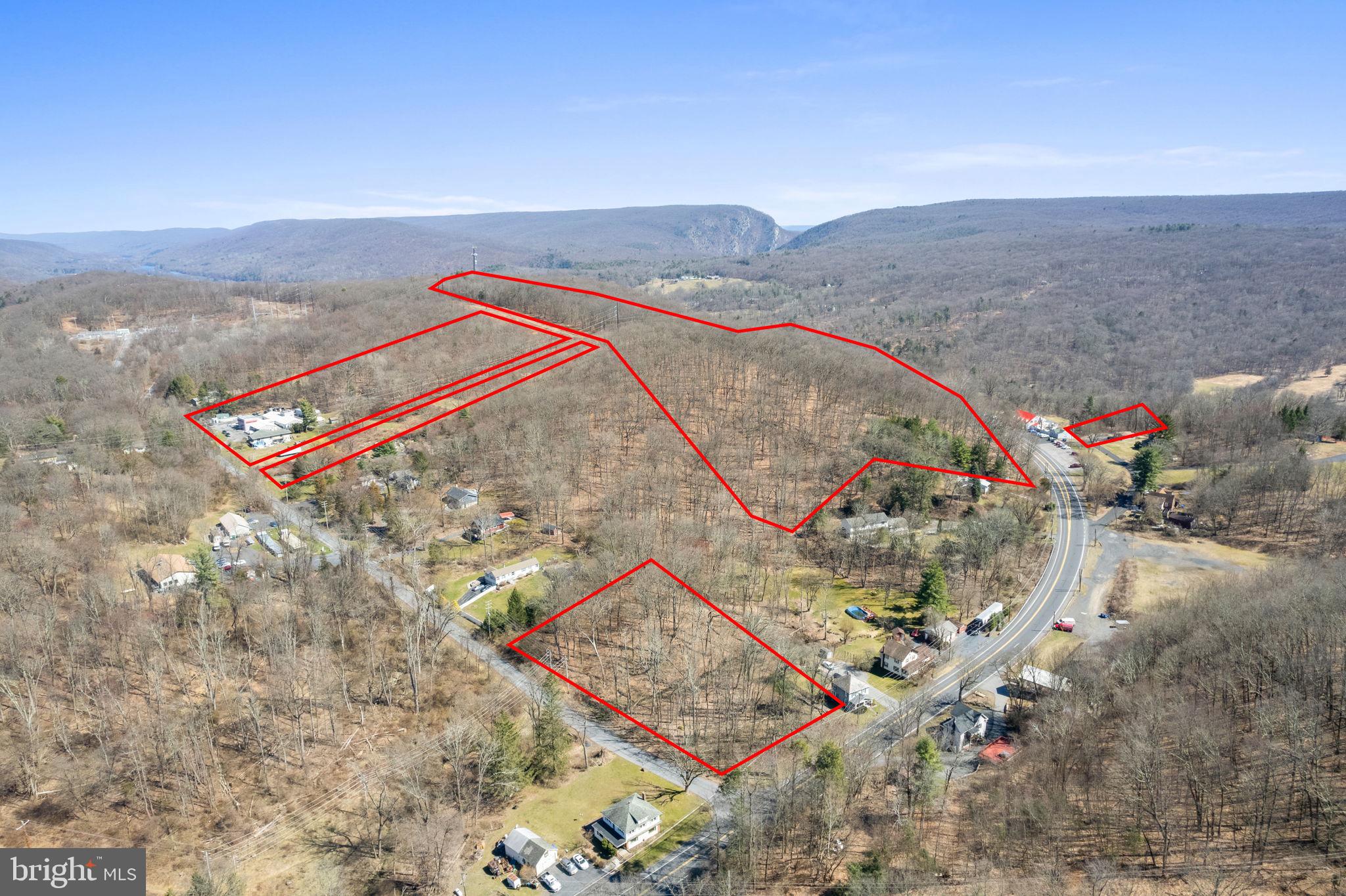 Opportunity is knocking with this package deal. A 38 unit motel on a large piece of land plus 3 other lots in the immediate area for sale. Plenty of development possibilities especially being 5 to 10 minutes drive from Stroudsburg and E. Stroudburg University. Campground, Tiny houses, Resort, Apartment complex, Housing development, Biking and Hiking trails. Bring your imagination for this one! A total of 1,053,596 sqft of possible development