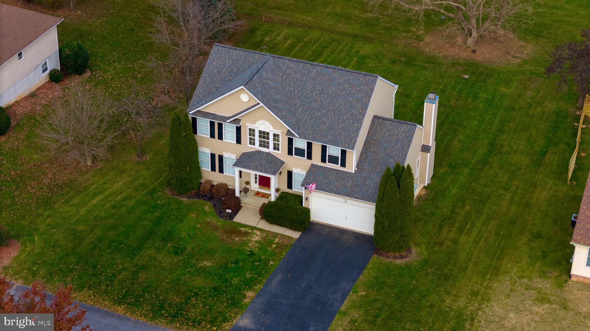 Beautiful home ideally located on a quiet dead-end street with mountain and pasture views and is ready for you to call home! Features include a newer roof and siding that were both replaced in 2018, stainless steel kitchen appliances purchased in 2021, all carpet and luxury vinyl plank flooring were replaced in 2021 and New Heat Pump installed in 2022. Spacious eat-in kitchen with island opens to the large family room with wood-burning fireplace. Tons of amenities with this from the vaulted primary bedroom ceiling, corner soaking tub in primary bathroom, crown molding, formal living and dining rooms, rear deck that was refinished in 2021, and full unfinished, walk-out basement with bath rough-in for future bath. Don't miss the opportunity to see this home!