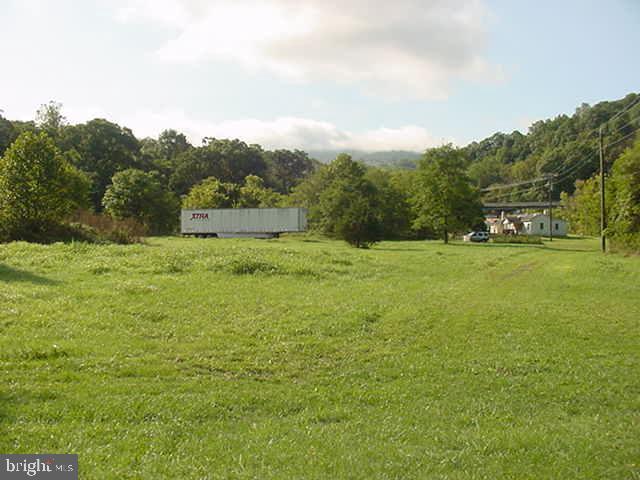 8 acres zoned commercial with over 600 ft state paved road front w/ 2 entrances * Includes two houses currently rented * Also conditional use permit for warehouses * Great location only 1.5 miles to I-66 at Linden! * Property offers unparalleled accessibility with unlimited commercial use possibilities!