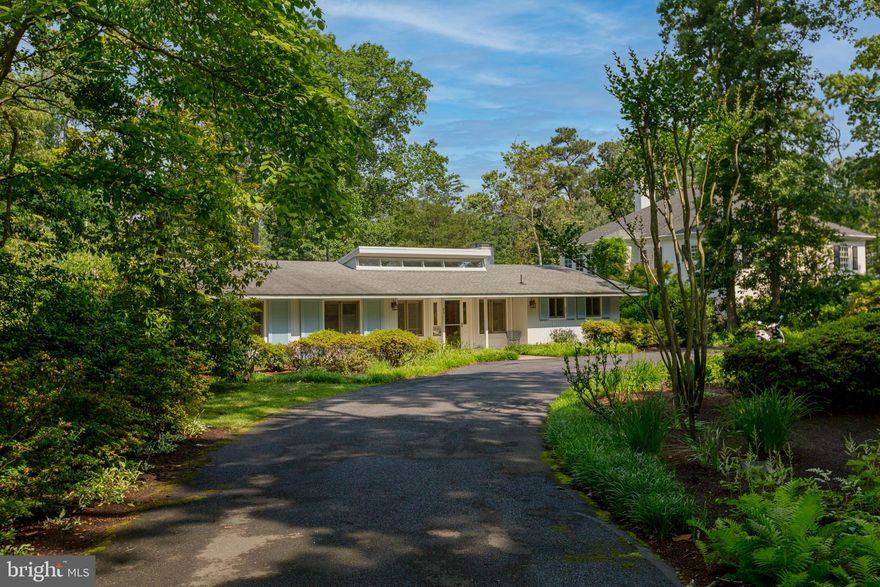 RARE canalfront opportunity to own a unique and rarely offered Henlopen Acres property. This canal-front town features 200 homes and is nestled adjacent to Rehoboth Beach. The home offers spacious, light-filled one-level living, a four season back porch and deck both overlooking the tidal waters of the Lewes Rehoboth Canal.  The canal features access to Rehoboth Bay, the Delaware Bay and the Atlantic Ocean.  As you enter the home you are greeted with views of the water, oversized living room, a wood-burning fireplace and expansive space for dining and entertaining. The kitchen opens to a bright living room with a wood burning fireplace and sliding doors to the water.  The owner's suite has an adjacent office and sliding glass doors which open to the back deck. Three additional bedrooms and a shared bathroom complete the sleeping quarters.  The additional appeal of this home is an approved bulkhead and dock permit that can potentially be conveyed to a Buyer with DNREC approval (permit expires Dec 2024).  Additional features of the town of Henlopen Acres include the marina (wait-list can apply) and the private beach, Block W, along with the opportunity to join the Henlopen Acres Beach Club and tennis club. This property affords endless possibilities to enjoy now or to renovate. Offered "as is." The town of Henlopen Acres has the first right of refusal on all home sales, there is also an architectural review process for any lot/structure improvements/updates.  Rentals are permitted with restrictions in the Town of Henlopen Acres.