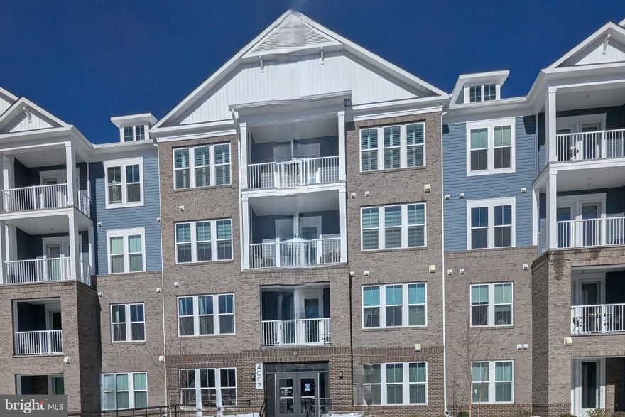 Why wait for new when you can purchase this 2025 Penthouse-level 3BR/2BA condominium featuring an open-concept floor plan with seamless flow between the living room, dining area, and kitchen, plus access to a private balcony. Over $45,000 in builder upgrades and options, plus approximately $6,000 in custom window treatments.

The gourmet kitchen includes quartz countertops, 4-inch granite backsplash, Kinsdale painted stone-gray cabinetry, satin nickel hardware, gray EVP flooring, pendant lighting over center island, deep stainless steel sink, pantry, coat closet, and GE stainless steel appliance package to include cooktop with built-in microwave, dishwasher, and bottom-freezer refrigerator.

Spacious foyer entry leads to a separate laundry room with full-size side-by-side washer and dryer (installed in mud pan), furnace unit, shelving, and EVP flooring.

Living room features recessed lighting, EVP flooring, and sliding glass door to balcony.

Primary suite includes walk-in closet, double windows, ceiling fan with light, recessed lighting, wall-to-wall carpet, and ensuite bath with ceramic tile flooring, double vanity, and oversized shower with built-in bench.

Secondary bedrooms each include walk-in closets, ceiling fans with lights, and wall-to-wall carpet. Third bedroom features five windows providing abundant natural light.

Hall bath includes ceramic tile flooring and full tub.

Premium upgrade includes the largest first-floor garage in the building plus a private enclosed storage room.

Condo/HOA amenities include clubhouse access, fitness center, outdoor pool, exterior and interior building maintenance, landscaping, snow removal of public roads/sidewalks/common areas, and concierge trash/recycling service.

Move-in ready penthouse offering upgraded finishes, private garage parking and low-maintenance living.