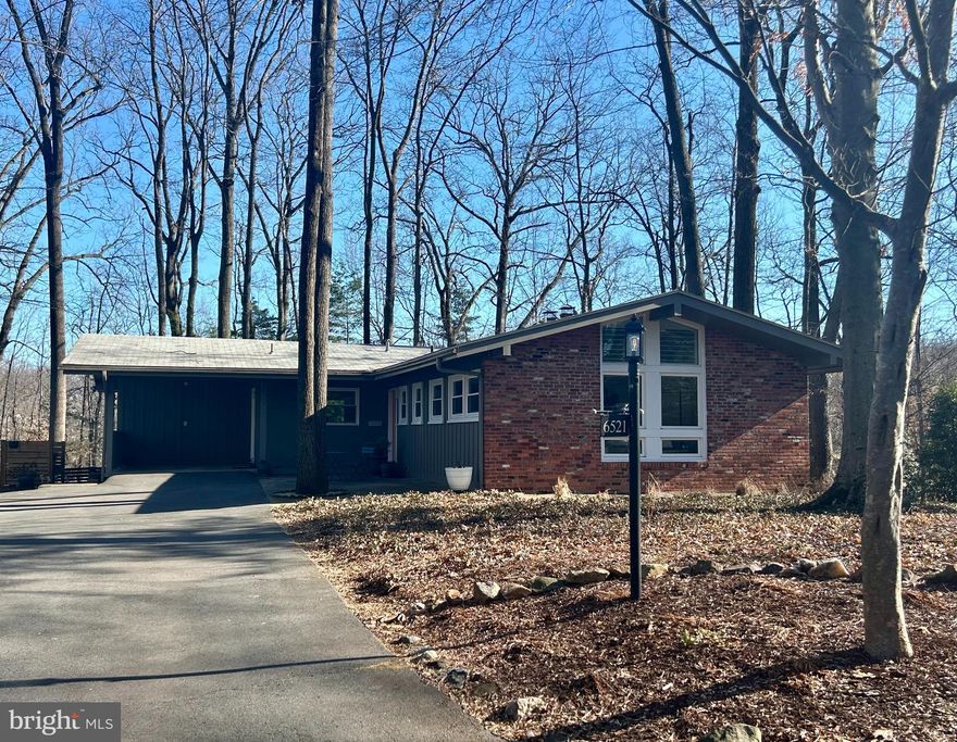 LAKE BARCROFT-Mid Century Modern! This stunning  home is filled with natural light, boasts expansive windows throughout and gleaming hardwood floors that flow throughout the open floor plan. The spacious kitchen is a chef’s dream, complete with stainless steel appliances, granite countertops, and ample cabinetry and opens to dining area and expansive living room with fireplace.  The main level boasts a serene primary suite with an en-suite bath with dual sinks and soaking tub, along with a second bedroom with brick wall  and a convenient powder room. Downstairs, the walk-out lower level offers even more space for living and entertaining. The large recreation room opens to a beautiful slate patio and a private backyard space. You'll also find a third bedroom, a second full bath, a laundry room, a workshop, and a versatile bonus room. Located just a block from one of Lake Barcroft's five private beaches for swimming, boating, and fishing, this home also offers easy access to major commuter routes (50/66/395/495) and is just minutes to Tysons, Arlington, and Washington, DC.