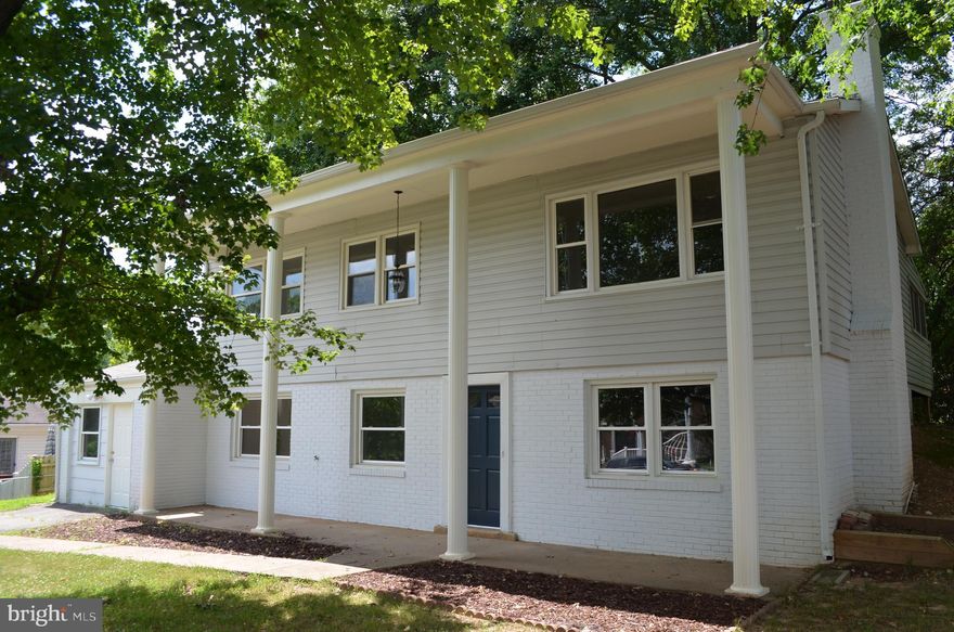 So Much To Offer!! Everything New Top To Bottom*Bi-Level 4 Bedroom 3 Full Bath Detached Home*Open Floor Plan*New High End Granite & Stainless Steel Kitchen with Tile Backsplash*New Wood Floors Throughout*Private Screened Deck*Dual heating system with High Efficiency Heat-pump*Three Season Room*Italian Tile in Remodeled Bathrooms*New Paint & Modern Light Fixtures*5th Bonus Room with Outside Entrance*Large Family Room in Basement with Brick Fireplace & Wood Burning Insert*Separate Laundry Room with Storage