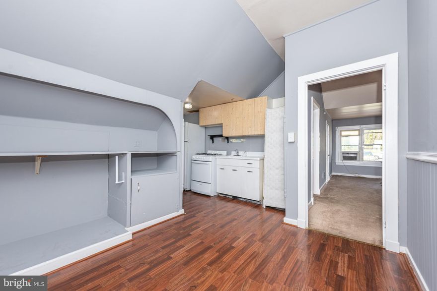 AFFORDABLE & SPACIOUS 2ND LEVEL APARTMENT LOCATED IN A CONVENIENT LOCATION!  Features include a large living room, dining area and kitchen with wood flooring, a spacious bedroom, and a full bath.  This unit is located in a multi-unit building with a main level commercial space and 3 additional residential units.  Off street parking and located minutes from shopping restaurants, & 695.  MUST HAVE GOOD CREDIT WITH NO HISTORY OF FAILURE TO PAY RENT FILINGS OR EVICTIONS