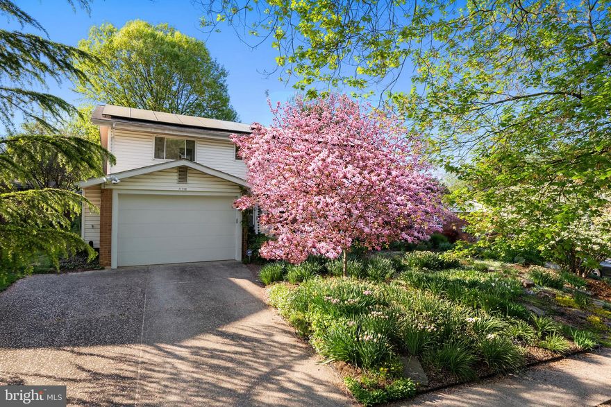 11112 Nicholas Drive is more than a beautifully updated home — it’s a place where community, comfort, and everyday enjoyment come together. This inviting 3-bedroom, 2 full and 1 half bath home offers updated bathrooms and kitchen, a garage, large bonus room, spacious basement with workbench and storage, and a wonderful three-season screened porch with a wood-burning stove that becomes the heart of the home on cool evenings.

Outside, the fully fenced backyard feels like a private retreat. Extensive landscaping, a peaceful pond, raised vegetable beds, pollinator-friendly gardens, and seasonal blooms create a setting that has been lovingly cultivated over many years. An irrigation system helps keep everything thriving, while the deck and screened porch provide perfect spaces to relax, entertain, or simply enjoy the quiet beauty of the garden.

Located in a warm and welcoming neighborhood with a true sense of community, neighbors gather on evening walks while enjoying nearby parks, playgrounds, and bike paths. Sligo Creek Park sits right at the end of the street, and everyday conveniences — including a kosher grocery, bakery, restaurants, and shops — are all within easy reach. Commuting is remarkably convenient with multiple routes into downtown DC, nearby Wheaton Metro access, a ride-on bus stop close by, and the future Purple Line offering even greater connectivity to Bethesda and NIH.

Wheaton’s celebrated dining scene is another local favorite, offering an incredible variety of beloved spots: Ruan Thai, Ren’s Ramen, Mi La Cay, El Pollo Rico, and many more. Frank’s Pizza is a must!. Combined with a solar system for added efficiency and a setting that encourages connection both indoors and out, this home offers a lifestyle that is increasingly hard to find.