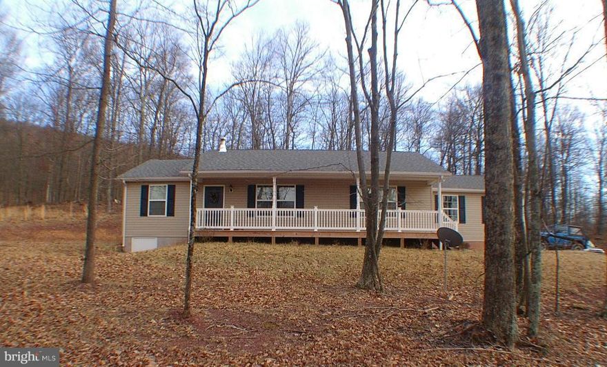 Just like new, well maintained 3 bedroom/2 bath rancher with attached garage. Located on  a quiet  cul-de-sack   on 2+/-  wooded acres. Peaceful private setting, backs up to  500 acre farm.  Just minutes from Slanesville store. Easy commute to Winchester.