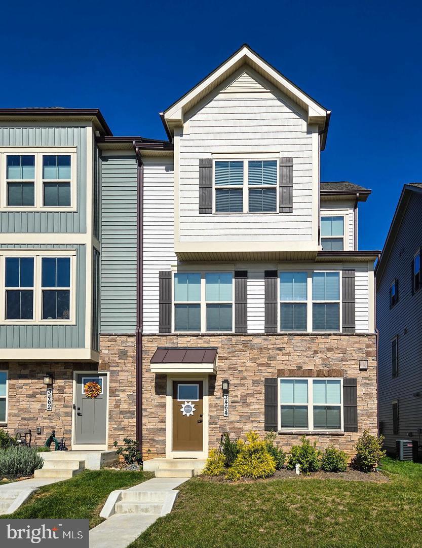 For rent! Welcome to Villages of Urbana, where luxury living meets convenience in the top-rated Urbana School District. This Stunning Serenade Model end unit townhome, modern elegance with this like-new townhome, featuring 4 Bedrooms, 3.5 Baths, and a 2-car attached garage, nestled in a vibrant community with exceptional amenities. This home offers an updated extended outdoor living with a covered deck included. Oak stairs leading to the main level with LVP flooring throughout. A luxury kitchen, dining room, great room, rec/office room, and extra windows that flood the home with natural light. The open concept layout provides the ideal space for entertaining guests or enjoying quality time with family. The upper level showcases a luxury kitchen equipped with custom cabinets, a large island, pendant lights, quartz counters, stainless steel appliances, pantry and half bath. Adjacent is the dining room with access to the outdoor living covered deck, a spacious great room, recessed lights, and luxury vinyl plank floors. Ascending to the upper level, you'll find the primary bedroom suite featuring tray ceilings, a sizable walk-in closet, and an en-suite bathroom with dual vanities and a walk-in shower with a seat. The two additional spacious bedrooms with generous closets, a full bathroom, and the laundry complete this level. The entrance level offers a foyer, hall closet, rec/office room (which could be converted into a fourth bedroom), a half bath, and access to the garage. This award-winning, masterfully planned community features: 3 parks, 3 pools (lazy river, fountain and slides), 3 community centers, 6 tennis courts, 3 basketball courts, pickleball, 18 tot lots, and miles of walking paths. Residents also enjoy access to the newest walk-able Stone Barn Village Community featuring a community clubhouse, recreation barn, pool, Sugarloaf Elementary and Goddard Schools. Conveniently located with easy access to major highways, local shopping, dining options, a farmer's market, YMCA and the library, this home truly offers the best of both worlds - luxury living in a prime location. Residents of this community enjoy access to a host of amenities, including a swimming pool, a well-equipped community gym, and proximity to local schools, grocery stores, and restaurants. This townhome’s location also makes it a great choice for commuters, offering easy access to major routes. This property represents a perfect blend of modern living, convenience, and luxury, making it an ideal choice for anyone looking to move into a home with all the benefits of community living and none of the wait of new construction. Embrace a lifestyle of convenience and style in a home that feels like new. This community is just off rt 270, rt 70 and minutes from downtown Frederick as well as tons of shopping, dining, hiking, biking and adventuring! The community has multiple playgrounds, ball fields and a skate park as well as plenty of green space. This home and area have it all!!