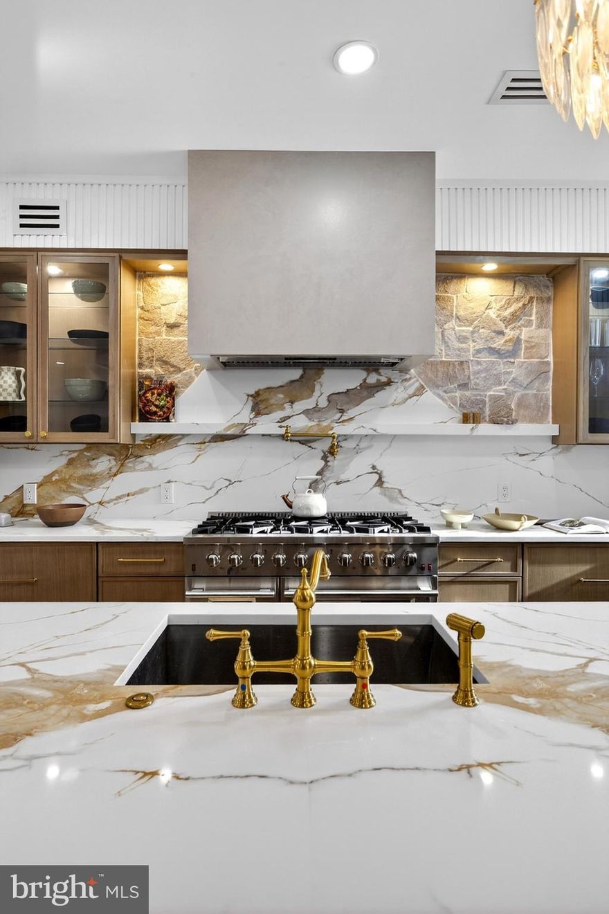 Welcome to a once-in-a-generation Victorian stone estate, lovingly restored and elevated into pure, museum-level luxury, where historic soul and modern refinement meet in breathtaking harmony.

Built over 100 years ago, this iconic Victorian residence stands proudly with true stone construction, rich architectural depth, and character that simply cannot be replicated today. Every inch of this nearly 3,600 square-foot home has been thoughtfully reimagined to honor its legacy while delivering the comfort, efficiency, and elegance today’s luxury buyer expects.

From the moment you enter through the 8-foot custom Dutch door, you feel it, this is not just a house, it’s a statement.

Inside, soaring ceilings, oversized show-stopping chandeliers (this home could genuinely be a gallery for chandeliers alone), and curated designer finishes set the tone. A warm, inviting living room centers around a beautiful fireplace with custom built-in benches, perfect for intimate gatherings, reading by the fire, or hosting unforgettable evenings. The formal dining space continues the drama with scale, light, and craftsmanship that command attention.

The chef’s kitchen is a work of art, anchored by Forno appliances, Fabuwood cabinetry, premium finishes, and a seamless blend of form and function. Entertain effortlessly with a bodega-style wine cooling refrigerator, ideal for collectors and hosts alike.

This home offers 5 generously sized bedrooms and 3.5 spa-inspired bathrooms, including a second-floor primary suite that feels like a private retreat. The primary bath is nothing short of spectacular, featuring:

A freestanding soaking tub

Marble tile throughout

Herringbone-pattern flooring

Elegant gold accents

A custom vanity

WaterSense smart toilets

A spacious walk-in closet

Luxury continues with a second-floor laundry suite equipped with GE and LG washer/dryer units, ensuring convenience where you need it most.

Outside, the rarity continues: a private driveway with parking for 6+ vehicles—an almost unheard-of amenity for a historic Victorian of this caliber.

This home is for the buyer who values heritage, artistry, and uncompromising quality. For someone who wants their home to tell a story, spark emotion, and stand apart from everything else on the market.

Historic. Grand. Irreplaceable.
This is not just where you live, this is where legacy lives on.