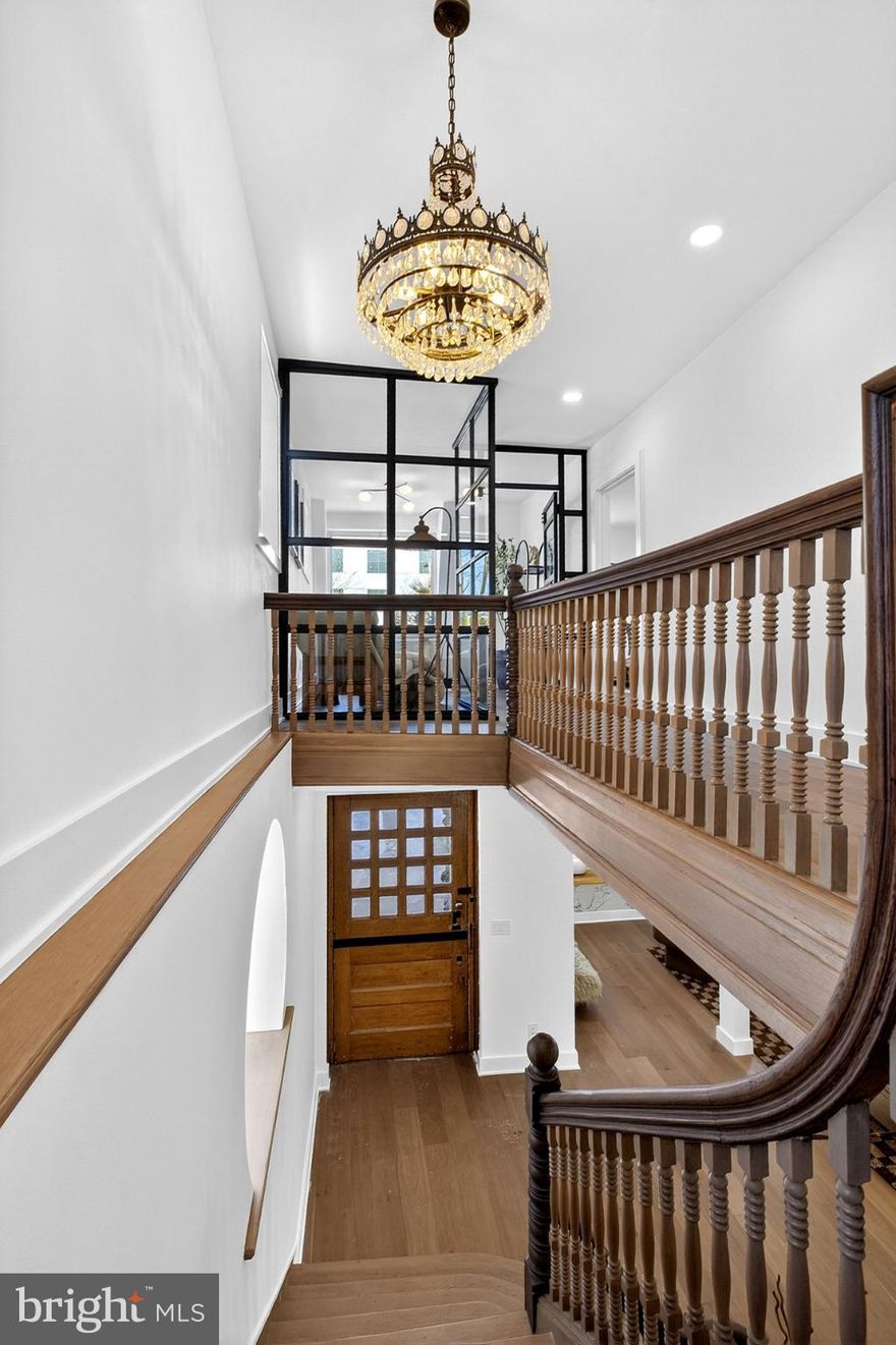 Welcome to a once-in-a-generation Victorian stone estate, lovingly restored and elevated into pure, museum-level luxury, where historic soul and modern refinement meet in breathtaking harmony.

Built over 100 years ago, this iconic Victorian residence stands proudly with true stone construction, rich architectural depth, and character that simply cannot be replicated today. Every inch of this nearly 3,600 square-foot home has been thoughtfully reimagined to honor its legacy while delivering the comfort, efficiency, and elegance today’s luxury buyer expects.

From the moment you enter through the 8-foot custom Dutch door, you feel it, this is not just a house, it’s a statement.

Inside, soaring ceilings, oversized show-stopping chandeliers (this home could genuinely be a gallery for chandeliers alone), and curated designer finishes set the tone. A warm, inviting living room centers around a beautiful fireplace with custom built-in benches, perfect for intimate gatherings, reading by the fire, or hosting unforgettable evenings. The formal dining space continues the drama with scale, light, and craftsmanship that command attention.

The chef’s kitchen is a work of art, anchored by Forno appliances, Fabuwood cabinetry, premium finishes, and a seamless blend of form and function. Entertain effortlessly with a bodega-style wine cooling refrigerator, ideal for collectors and hosts alike.

This home offers 5 generously sized bedrooms and 3.5 spa-inspired bathrooms, including a second-floor primary suite that feels like a private retreat. The primary bath is nothing short of spectacular, featuring:

A freestanding soaking tub

Marble tile throughout

Herringbone-pattern flooring

Elegant gold accents

A custom vanity

WaterSense smart toilets

A spacious walk-in closet

Luxury continues with a second-floor laundry suite equipped with GE and LG washer/dryer units, ensuring convenience where you need it most.

Outside, the rarity continues: a private driveway with parking for 6+ vehicles—an almost unheard-of amenity for a historic Victorian of this caliber.

This home is for the buyer who values heritage, artistry, and uncompromising quality. For someone who wants their home to tell a story, spark emotion, and stand apart from everything else on the market.

Historic. Grand. Irreplaceable.
This is not just where you live, this is where legacy lives on.