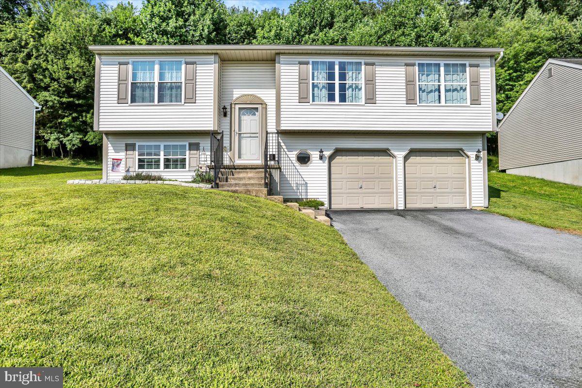 Welcome to 1017 Saylor Drive, a spacious and well-maintained bi-level located in the desirable Muhlenberg SD. This 3-bedroom, 2-full bath home offers over 2,200 square feet of finished living space, including a partially finished lower level with a full bath—ideal for a family room, home office, or guest suite.
Upstairs, you'll find an open-concept living and dining area, 3 generously sized bedrooms and a 2nd full bath. Situated on a 0.17-acre lot backed up to a large wooded area, this home offers privacy and easy access to local schools, shopping, and major commuter routes. Don't miss your opportunity to own this great home, schedule your showing today!