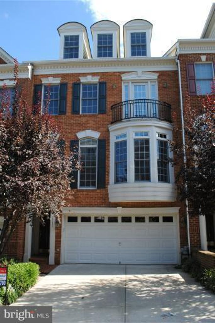 4-Level Townhouse in Gated Community – Available and Ready

Discover this elegant 4-level townhouse located in a charming gated community. The home boasts a spiral staircase that gracefully leads to the main living quarters, featuring stunning hardwood floors throughout the main level. Enjoy cozy evenings in the family room with a fireplace, or step out onto the balcony with a pergola ceiling for outdoor relaxation and entertaining.  The lower level has a full bathroom, built in cabinets and desk for office space use with access to the backyard bricked patio.

Highlights:

Living Space: The open floor plan includes high-quality finishes and trim in the dining and living rooms, with ceilings reaching nine and ten feet high. Natural light streams through tall windows, creating a bright and inviting atmosphere.

Kitchen & Appliances: The modern kitchen is equipped with stainless steel appliances and granite countertops. Additional upgrades include a central vacuum system and two fireplaces.

Bedrooms & Bathrooms:

Primary Bedroom: Features a slanted ceiling, ample closet space, and an ensuite bathroom with a shower and soaking tub.
Second Bedroom: Ideal for an office or guest room, with its own full bath.
Fourth Level: Includes a bedroom, full bath, and a cozy sitting area, offering privacy and flexibility.
Outdoor Spaces: Enjoy the private balcony off the living room, perfect for entertaining, and a fenced patio off the office/recreation room, providing added privacy.

Location: Situated less than a mile from Tyson’s Metro stations and Mall, with excellent access to major routes such as Rte 7, 123, 66, and the beltway.

This townhouse is available immediately and offers both luxury and convenience in a sought-after location. Don’t miss the chance to make this your new home!