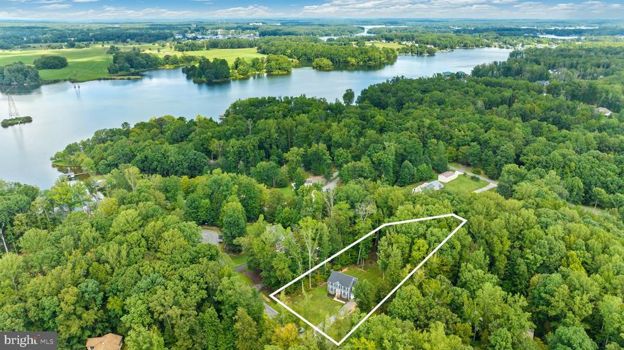 Almost an acre at the lake! This almost new construction, stunning home is move-in ready with tons of upgrades already built-in. LVP flooring in most of the living spaces, crown molding in the formal dining area and plantation shutters throughout the whole home! You'll love the upgraded cabinetry, stainless appliances and granite counters. The large family room is just off the kitchen, making this a perfect layout for entertaining. Also on this level, you'll find a formal living room/bonus flex room and a half bathroom. Head upstairs to find the generous primary suite with bonus reading nook and built-in shelving. The ensuite bathroom has a nicely sized walk-in shower with upgraded floor to ceiling tiling. Also on this level you'll find three more ample bedrooms, an additional full bathroom and laundry closet with washer and dryer that convey! Out back you'll find a nicely sized deck that overlooks the fully fenced in, tree-lined backyard. Cuckoo's Nest offers the very best of lake living with deeded boat slips and stunning views of Lake Anna. Recently expanded Firefly Fiber Broadband is available at the home so internet access is a breeze. Close to restaurants and shopping, while still feeling secluded, this location offers the best of both worlds! Should you assume the loan, current monthly payments are approximately $2969. Reach out for more details!