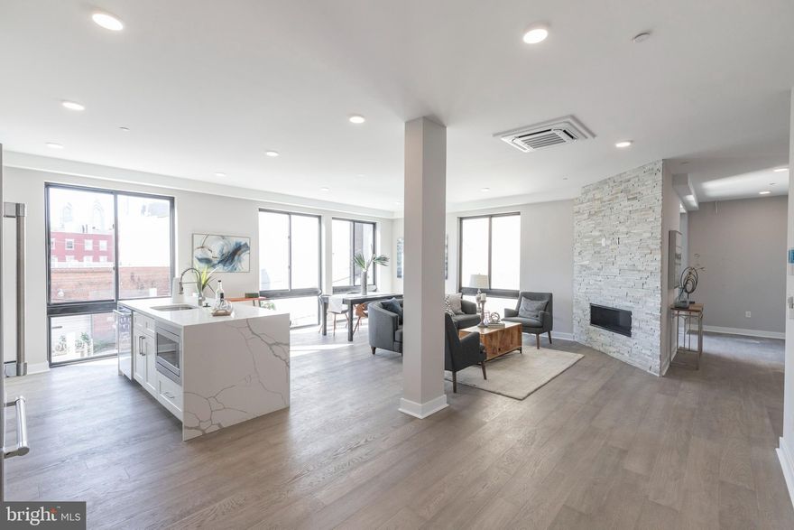Discover the amenities and luxury afforded by the condos at the Views on Swain.  Located at 716 N. 15th Street, at the corner of N 15th and Swain Streets,  the new-construction units in this boutique 5 residence luxury condo building have it all:  privacy, thoughtful design, fine finishes and spectacular views.  Unit 5 is accessed by a commercial-grade elevator providing convenient and secure access directly to the unit.  Step off into a spacious open living area with gas fireplace and a south facing wall of floor-to-ceiling windows offering breadth-taking Center City views.  The open layout flows into a designer kitchen with everything expected in high end construction: sleek white cabinetry, glass tile backsplash, a Jenn Air stainless appliance package, quartz countertops and a waterfall island accommodating bar seating.  Down the hall past the laundry/utility closet is a 3-piece hall bath,with tub, that is adjacent to a secondary bedroom that is spacious enough to serve double function as an office and bedroom.  Finally, there is the primary bedroom.  Situated in the southeast corner, it has windows on 2 sides, a walk-in closet and an en suite bath with porcelain tile, a dual wall-hung vanity and spacious double shower enclosure with rain head.  Nearly as appealing as the aforementioned finishes and other upgrades like the state of the art sound-proofing and the highly efficient  cassette multi-zone HVAC system is the buildingâs convenient location.  Located near all that is happening on the eastern end of Fairmont Avenue and the Avenue of the Arts North, it is but a  short walk to Center City, close to public transportation (1 block to the Broad Steet Subway), and in proximity to Kelly Drive and Fairmount Park.  Building units come with a 10-year tax abatement and 1-year builder's warranty. **Taxes and Condo Fees are estimates only.