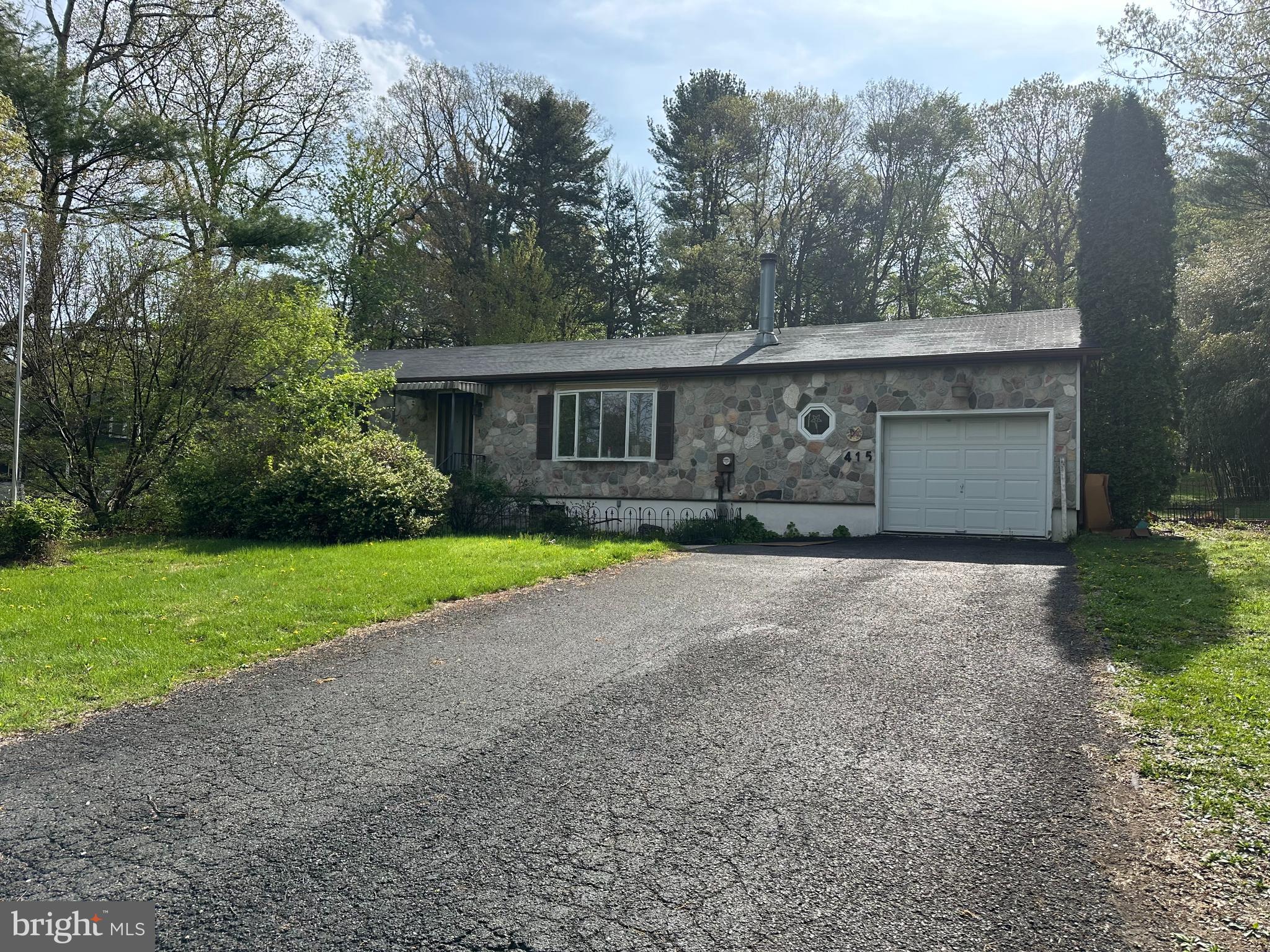 Home is just waiting for an investor or owner looking to build equity !!! This home is being sold in as is condition and some items maybe left on the property. The structure is sound with a very large basement and private backyard setting. Easy access to the turnpike and just off of route 209. This two bedroom, two full bathroom home also has a wood burning fireplace in the living room. The wheelchair ramp in the garages can easily be removed. Owner has never lived in the property. Make your appointment today!!!