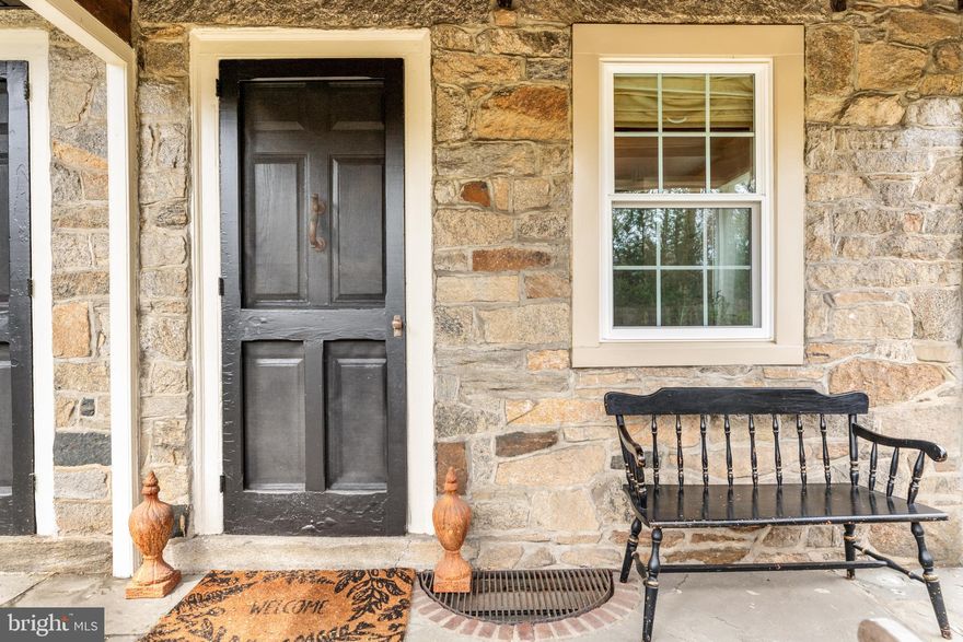 AMAZING NEW PRICE!  A house like this does not come up for sale often! Own a piece of history AND an enchanting stone house that dates back to 1798 – all within an easy walk of the train, schools, library and Post Office. Gorgeous wide plank floors, five fireplaces, extra deep windowsills and a garage that was once a stable are some of the delightful features you’ll discover inside this special home, known as “Hinkson’s Corner.”  More than 200 years ago, James Hinkson, a wheelwright, erected two buildings side-by-side, one for himself and the second for a blacksmith. In later years, Hinkson’s Corner served as a general store, and at one point, a summer resort.  Hinkson’s Corner has been tastefully updated by the current owners while preserving much of the charm of yesteryear, including a NEW roof, NEW windows, and convenient first floor Laundry. The main floor of the house features a Living Room, Dining Room, Kitchen with Butler’s Pantry and Laundry, an adorable Powder Room and brick-floored Mud Room just off the Kitchen.  On the second floor, you will find four Bedrooms, including one currently used as a Library, and a second, currently used as an enormous Family Room. There is a very spacious full Bath on this floor too (complete with a fireplace!). But there’s more! An amazing third floor awaits you. There are two entrances to two separate third floors, which harkens back to the two original buildings built side-by-side. One third floor features two Bedrooms and a full Bath.  The second third floor offers a Bedroom, Den space and a full Bath. This home is as enchanting on the outside as the inside with meandering brick paths, a “secret” gathering spot, and a simply gorgeous brick courtyard with a koi pond and black wrought iron gate. There is also a greenhouse. The yard is spacious and incredibly private – a feast for the eyes.  There is driveway parking for 6 cars plus the garage. The house has been freshly painted inside and out and the sellers recently purchased a NEW furnace. 1 E. Brookhaven Road is located in award-winning Wallingford Swarthmore School District and is a short train ride to downtown Philadelphia and less than 20 minutes to the airport.  Don’t miss this special home!