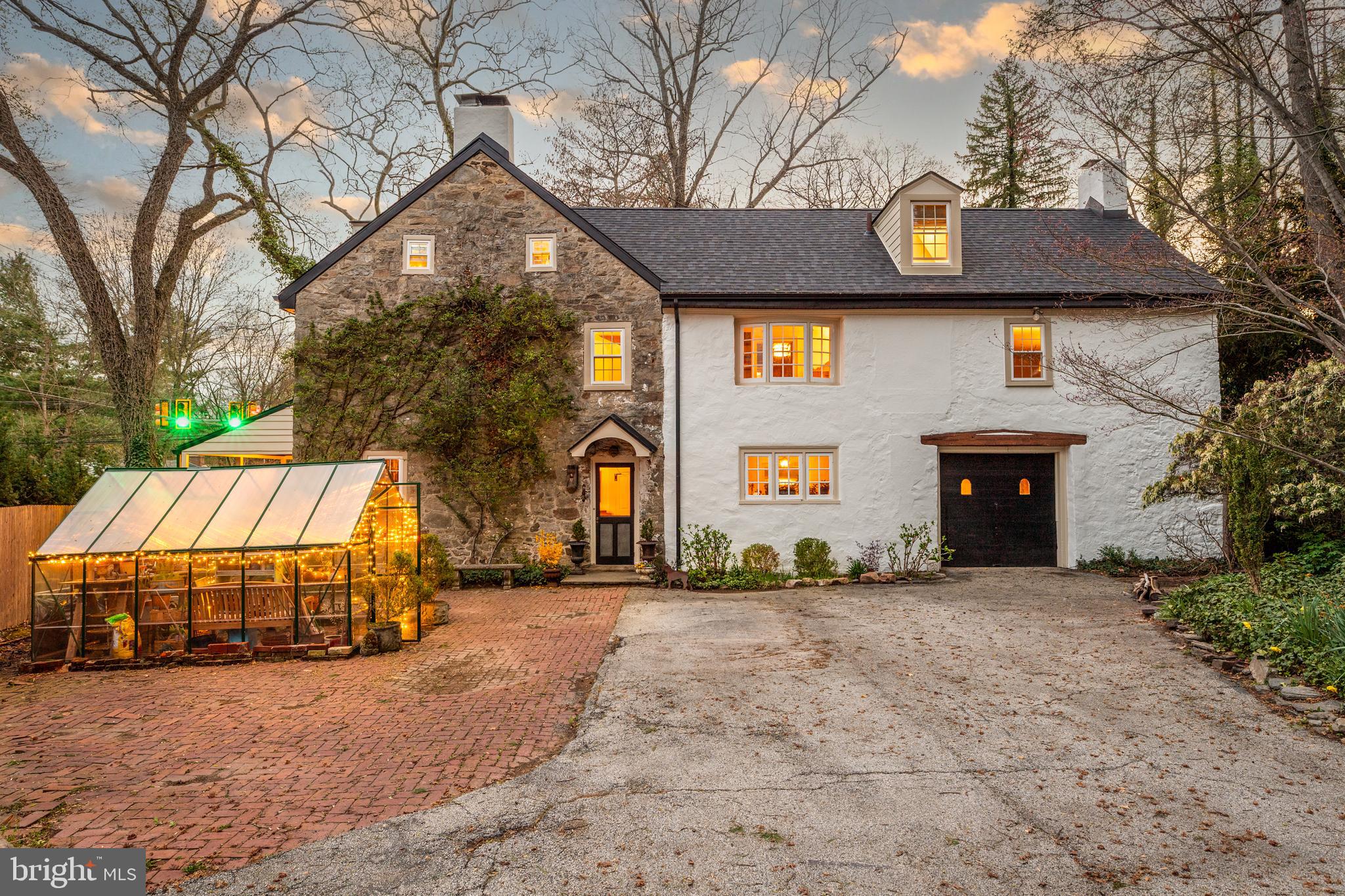 Own a piece of history AND an enchanting stone house that dates back to 1798 – all within an easy walk of the train, schools, library and Post Office. Gorgeous wide plank floors, five fireplaces, extra deep windowsills and a garage that was once a stable are some of the delightful features you’ll discover inside this special home, known as “Hinkson’s Corner.” More than 200 years ago, James Hinkson, a wheelwright, erected two buildings side-by-side, one for himself and the second for a blacksmith. In later years, Hinkson’s Corner served as a general store, and at one point, a summer resort. Hinkson’s Corner has been tastefully updated by the current owners while preserving much of the charm of yesteryear, including a NEW roof, NEW windows, and convenient first floor Laundry. The main floor of the house features a Living Room, Dining Room, Kitchen with Butler’s Pantry and Laundry, an adorable Powder Room and brick-floored Mud Room just off the Kitchen. On the second floor, you will find four Bedrooms, including one currently used as a Library, and a second, currently used as an enormous Family Room. There is a very spacious full Bath on this floor too (complete with a fireplace!). But there’s more! An amazing third floor awaits you. There are two entrances to two separate third floors, which harkens back to the two original buildings built side-by-side. One third floor features two Bedrooms and a full Bath. The second third floor offers a Bedroom, Den space and a full Bath. This home is as enchanting on the outside as the inside with meandering brick paths, a “secret” gathering spot, and a simply gorgeous brick courtyard with a koi pond and black wrought iron gate. There is also a greenhouse. The yard is spacious and incredibly private – a feast for the eyes. There is driveway parking for 6 cars plus the garage. The house has been freshly painted inside and out and the sellers recently purchased a NEW furnace. 1 E. Brookhaven Road is located in award-winning Wallingford Swarthmore School District and is a short train ride to downtown Philadelphia and less than 20 minutes to the airport. Don’t miss this special home!