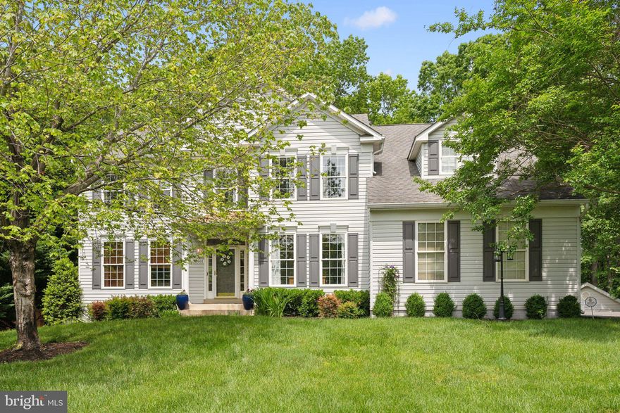 Welcome to this beautiful home, offering over 5,500 square feet of luxurious living space designed for comfort, entertaining, and everyday functionality. Situated on a private, tree-backed one-acre lot with no HOA, this residence truly has it all.
Inside, hardwood floors flow throughout the main and upper levels, setting the tone for timeless elegance. The gourmet kitchen is a chef’s dream, featuring quartz countertops, a center island with breakfast bar, tile flooring, under-cabinet lighting, stainless steel appliances, a 5-burner gas cooktop, convection wall ovens, and a walk-in pantry. Just off the kitchen, a sun-drenched morning room with walls of windows leads to a spacious composite deck—ideal for gatherings or quiet coffee mornings.
The stone facade fireplace is a show stopper creating the perfect space for cozy nights or lively celebrations. Formal living and dining rooms showcase crown molding and chair rail accents. A dedicated main-level office includes custom built-ins and two quartz-topped workstations—perfect for working from home. The mudroom/laundry room offers a utility sink and direct access to the oversized two-car side-load garage.
Upstairs, all  four bedrooms are beautifully renovated, as well as the bathrooms, which feature marble countertops and heated tile floors. The luxurious primary suite includes a custom dressing area, electric fireplace, built-in reading lights, and a beautifully designed closet. The spa-inspired primary bath boasts dual vanities, a soaking tub, separate shower, and a convenient hair styling drawer with built-in electrical outlets.
The finished lower level is a true retreat, complete with luxury vinyl tile flooring, a cozy fireplace, a full bath, and expansive recreation space—perfect for game tables, lounging, or hosting. Enjoy your own private theatre room, a home gym with rubber flooring and full-length mirrors, and a custom bar with a live-edge wood countertop,  and a beer and wine fridge.
Outside you will find a  multi-tiered, lighted deck overlooking a flat, private backyard. Additional features include large driveway, and rare public water/sewer on acreage.