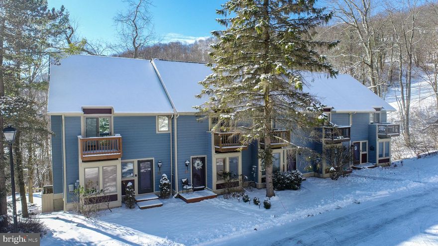 Located in the Villages of Wisp, this 3-bedroom, 3-full bath townhome offers direct ski access with a connecting trail to Down Under and community access to Deep Creek Lake. The unit is tastefully updated and sold turn-key, making it easy and ready-to-use today! The main level features hardwood floors, an updated kitchen with granite countertops, stainless steel appliances, custom cabinetry, and a breakfast nook. Seasonal lake views add to the setting, with central access to Wisp and surrounding Deep Creek amenities. A clean, functional layout in a proven mountain location. Call today for details!