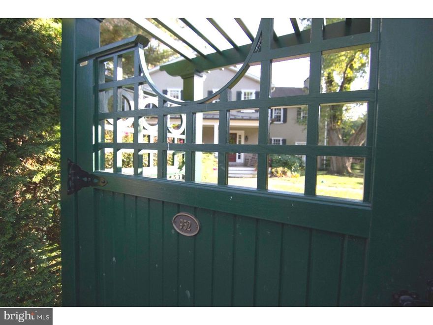 Bliss is Here. Enter through the front gate and a world of luxuriant delights is revealed. With this property's imaginative landscape, awareness of the outside world quickly slips away.  As you step onto the welcoming front porch it is easy to imagine outdoor entertaining, cocktails at sunset or sipping morning coffee? in complete privacy. This fully fenced .84 acre property features a 20'x20' vegetable garden and 60' saltwater lap pool tucked amid rocky berms brimming with beautiful landscaping. Renowned architect, Peter Archer, helped recapture the spirit of this 1880 farmhouse with the addition of a farm-style porch, shutters, and true-divided light windows throughout. Enter the main foyer flanked by a dramatic double staircase gleaming with sunlight that opens to a gracious, sunken living room. This inviting space is replete with commissioned stained glass windows, wood- burning fireplace, built in cabinetry and hard wood floors. Nestled beneath the staircases are a powder room and ample coat closet.  A renovated kitchen with a separate porch entrance boasts a soapstone island, Carrera marble countertops, plentiful storage and top-of the-line Wolf and Sub Zero appliances; its thoughtful layout is a cook's dream. A dining room and library with gas fireplace offer more opportunity for family time. The layout of the first floor is perfect for entertaining.  A separate entrance and back staircase lead to an en-suite bedroom that is the perfect configuration for a nanny or in-law.  The intimate master bedroom boasts five-inch plank hardwood floors, gas fireplace, and cathedral ceilings. The master bathroom features an oversized tub, tumbled Carrera marble shower and countertops, luxurious rain shower and a recently added custom closet. A centrally located bedroom streams with light and features large closets, enchanting attic door, and exposed beams. But that's not all; there is a fourth bedroom with a shared bath that looks out to the entryway courtyard. This private oasis is located in the Award Winning Lower Merion School District and is just minutes from Center City Philadelphia, trains, shopping and dining.