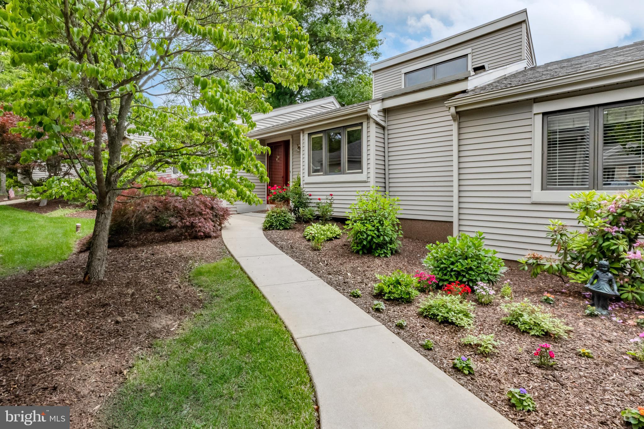 Welcome to 562 Franklin Way in the sought after 55+ community of Hershey's Mill in West Chester, PA. This charming 2-bedroom, 2.5-bathroom home is perfect for anyone looking for comfort and convenience. With approximately 1,500 square feet of living space, it offers a cozy yet spacious feel.
Step inside to find beautiful hardwood floors that run throughout the main areas. The living room is inviting with its warm fireplace, vaulted ceilings and stunning transom windows, perfect for spending time with family and friends. One of the standout features of this home is the sunroom (measuring 12' x 18'), complete with wall-to-wall windows. This sun-filled space can be enjoyed year-round as you take in the stunning panoramic views of the 9th tee—ideal for entertaining or simply relaxing with a book.
The heart of the home, the kitchen, is a delightful space equipped with stainless steel appliances, a Kraus sink, marble tile backsplash, and stunning granite countertops. You'll love the eat-in kitchen setup—perfect for casual dining. Retreat to the primary bedroom, offering serene golf course views that promise a peaceful start to each day. This private sanctuary features a generous walk-in closet and an en-suite primary bathroom. Rounding out the first floor is an additional guest bedroom, hall bathroom and laundry.
Downstairs, the basement adds extra living space with a comfy carpeted area and a handy powder room—this space is just waiting for your personalization. This level offers plenty of space for storage, a workshop with work bench and utility sink, as well as a cedar closet.
Living in Franklin Village comes with its perks, including access to its own community pool, perfect for enjoying sunny days. Come see why 562 Franklin is a great place to call home!
*List of improvements attached under "documents".