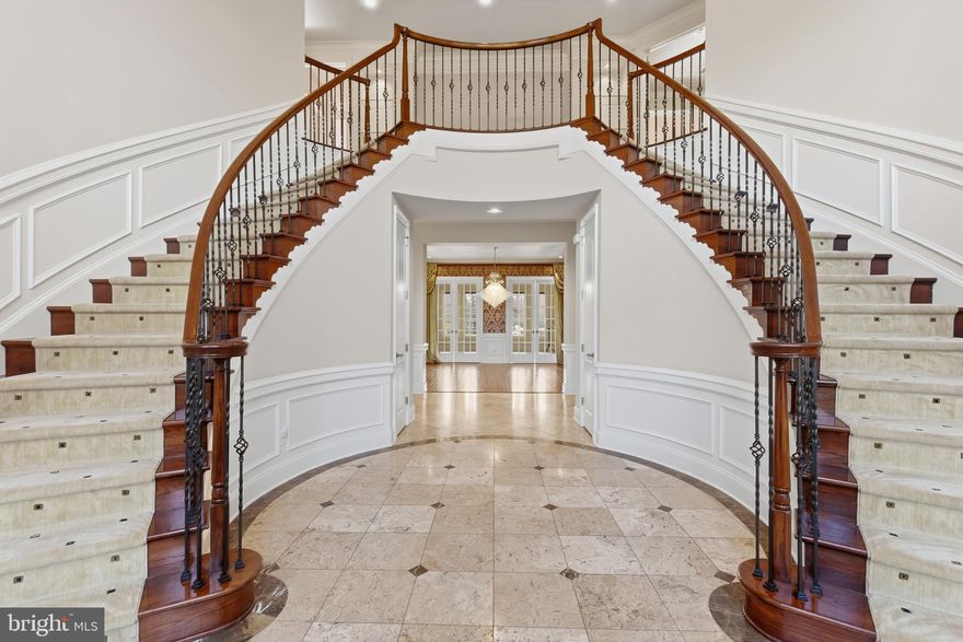 This meticulously upgraded residence was designed for both grand entertaining and calm retreats. This home sits in a cul-de-sac, with a sub-community of 12 homes. Quiet street and once the Former Model Home.  Travertine flooring (limestone) found on the main level. BONUS: In-law suite on the 1st floor with full bath and large closet.  It features multiple luxurious gathering spaces, resort-style outdoor amenities, and elegant architectural detailing throughout — all within one of Ashburn’s most coveted gated neighborhoods. Whether you’re hosting guests poolside, enjoying theater-level entertainment, or watching the sunset from your terrace, 43589 Edison Club Court sets a benchmark in upscale living. This elegant entertainer's estate offers  5 Beds, 5 Full/2 Half Baths,  and over 10,000+  sq.  ft. of living space.

Nestled in the gated Belmont Country Club community, this custom semi‑built estate sits on approximately 0.54 acres with impressive views of a golf course and serene lake from the upper‑level terrace.
Spacious luxury living across two family entertainment floors and finished lower basement.  See the 
spectacular outdoor spaces: Designed for entertaining with a salt‑water pool and spa, expansive patio and hardscape, screened porch, plus a veranda with outdoor kitchen and wood‑burning fireplace. 
Stunning Interiors include rich travertine and hardwood flooring, soaring ceilings, custom moldings, a grand foyer with butterfly staircases, and a double‑sided fireplace linking the family room and kitchen. The gourmet kitchen is equipped with commercial-grade stainless steel appliances, a center island, a pantry and opens to the family room. The versatile main level living includes a second primary suite, extensive built-ins, and a solarium party/music room with a built-in bar. Must see in person to appreciate the beauty of this magnificent home.

Amenities Galore: Finished four-car garage; professionally designed multi-level theater, full dance floor, designer decor, and impeccable, move-in ready condition with over $500k in builder upgrades. The entire roof was recently replaced, and electric shades throughout the home will convey.
