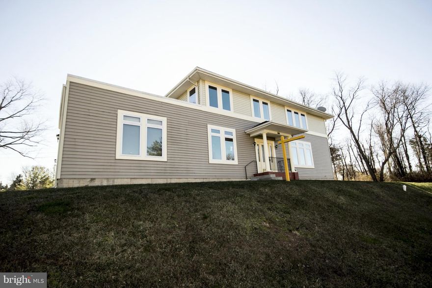 Freshly renovated w/many updates!  New flooring, new kitchen w/SS appliances, freshly painted - Move right in!  Enjoy bright, spacious room sizes. Family Room w/ gas fireplace. The add'l garage space fitted for a lift is perfect for car enthusiasts!   Finish the large walk out basement for additional living and storage space.  Convenient location close to shopping/dining and the Baltimore Beltway.