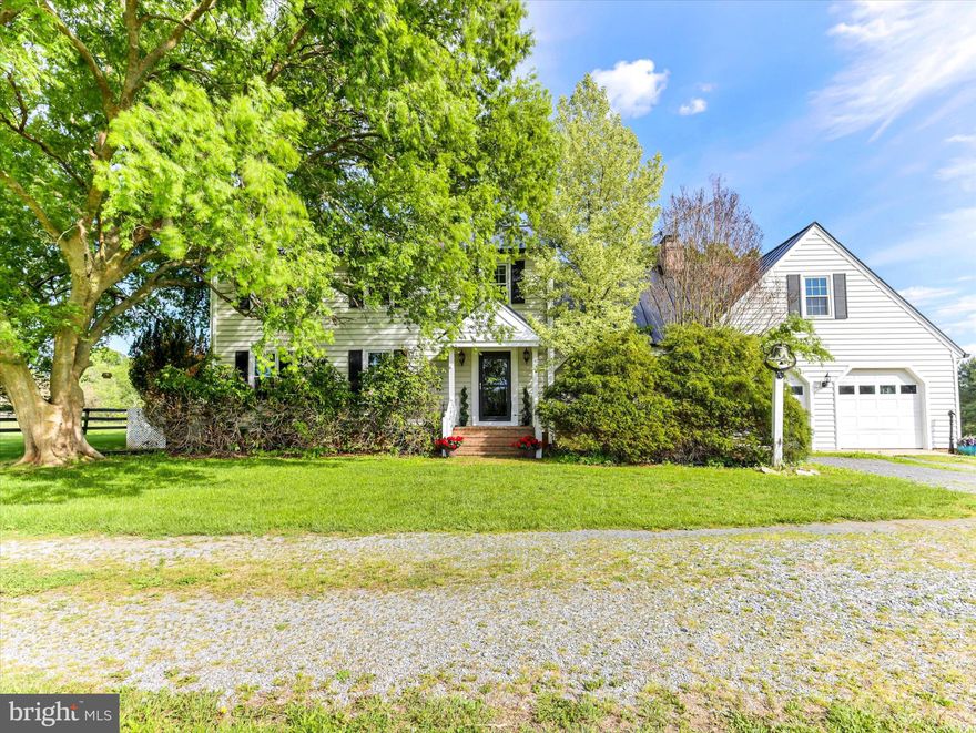 Nestled on a sprawling 19.39-acre lot, this exquisite Colonial-style residence offers a harmonious blend of luxury and comfort, perfect for those seeking a country lifestyle. The property, thoughtfully renovated in 2020, showcases a timeless design with modern amenities, ensuring a warm and inviting atmosphere throughout. Step inside to discover a spacious interior adorned with rich hardwood flooring and  crown moldings. The traditional floor plan features a formal dining room, ideal for hosting gatherings, and a cozy family room that seamlessly connects to the eat-in kitchen. The kitchen has hardwood floors, a double oven, electric range, and a stylish cooktop, all complemented by an efficient exhaust fan and a convenient dishwasher. Enjoy your morning coffee in the charming breakfast area, bathed in natural light from energy-efficient windows. With four  generously sized bedrooms and two and a half bathrooms, this home provides ample space for relaxation and privacy. The inviting family room, complete with a gas/propane fireplace, serves as the heart of the home, while an additional fireplace in the living area adds a touch of warmth and elegance. The partially finished basement offers versatile space for a home gym, workshop, or additional storage. The exterior of the property is equally impressive, featuring extensive hardscaping that enhances the outdoor living experience. A spacious patio invites you to unwind while taking in the serene views of the surrounding pastures. For equestrian enthusiasts, the property is a true paradise, boasting a range of horse amenities including a riding ring, stable, paddock, and an arena, all designed to cater to your equestrian needs. Additional features include an oversized attached garage with space for two vehicles, a stone driveway for added charm, and multiple outbuildings for storage or hobby use. The property is securely gated, providing peace of mind while you enjoy the tranquility of rural living. This exceptional residence not only offers a desired lifestyle but also a unique opportunity to embrace the joys of country living, all while being just a short drive from urban conveniences. Experience the perfect blend of  comfort, and equestrian amenities in this stunning home. Zoned AR1 endless possibilities, bring your pets, grow your vineyard, grow your own garden and ride in the beautiful field surrounding your home. Seller not responsible for roll back taxes, Non HOA.