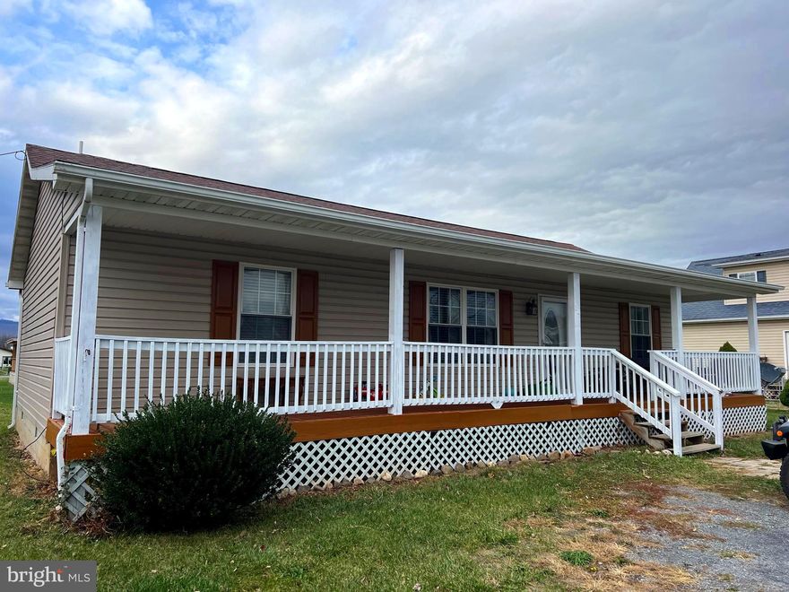 Conveniently located and priced to sell is this nice three bedroom, two bath home near the center of Moorefield and within easy walking distance to Pilgrims.  Outbuilding conveys, as well as Range, Refrigerator, Dishwasher, Washer and Dryer.  Ready to move into. Beautiful mountain views to the southeast from front porch!River nearby but its not in flood plain. Yard is fenced on 3 sides. Nice quite neighborhood!