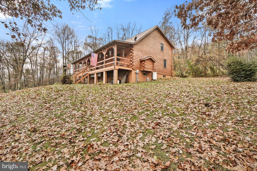 Bring your livestock and enjoy this private secluded retreat on nearly 60 wooded acres (2 separate parcels, 11.9 acres on parcel 1, and approximately 47 acres on parcel 2).  This property is ideal for nature lovers and discerning homebuyers seeking tranquility and privacy.  An abundance of trails to enjoy for hiking or riding.   Experience the perfect blend of rustic charm and modern convenience with this meticulously maintained log cabin.  

The cabin offers spacious and comfortable accommodations for you and your guests with main-level living with easy access to all amenities, (primary bedroom & bedroom #2, full bath), a huge country kitchen with oak cabinets and ceramic tile (perfect for creating culinary delights amidst the serene backdrop of nature), cozy up by the fire and enjoy the warmth and ambiance of a classic stone fireplace with gas logs in the living room with vaulted ceilings, upper level with 2 bedrooms and 1 full bath, loft overlooking the living room, and a large front porch for family gatherings.

The cabin was built with 6 x 8 white pine log with tongue & groove throughout.  Several acres of fenced rolling pastures, for those with horses or simply a love of open spaces, run-in shed with water and electric (a functional addition for your farming or animal husbandry needs).  While offering a private retreat, this property is just minutes from the interstate for easy commuting. This unique property combines the allure of country living with modern upgrades, providing a peaceful haven that’s still connected to the conveniences of modern life.  Don't miss the opportunity to own this captivating log cabin retreat.