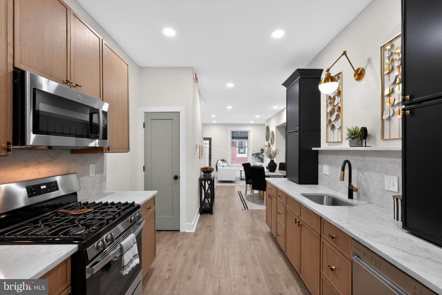 Welcome to this beautifully renovated three-bedroom, one-and-a-half-bath home located in the heart of Squirrel Hill! Step inside to find brand-new laminate wood flooring flowing throughout the spacious living room, dining room, and kitchen, creating a modern and cohesive feel throughout the main level. The fully renovated kitchen is sure to impress with its stylish two-tone cabinetry featuring sleek black upper cabinets, gorgeous granite countertops, stainless steel appliances, and chic gold and black hardware accents that add the perfect designer touch. The main level also includes a conveniently located newly renovated half bathroom. Upstairs, you’ll find three spacious bedrooms, all complete with laminate wood flooring, along with a fully renovated hall bathroom featuring a ceramic tile shower surround, brand-new tub, modern vanity, and new commode. This move-in ready home combines stylish finishes with thoughtful updates throughout and is ready for its next owner to move right in!