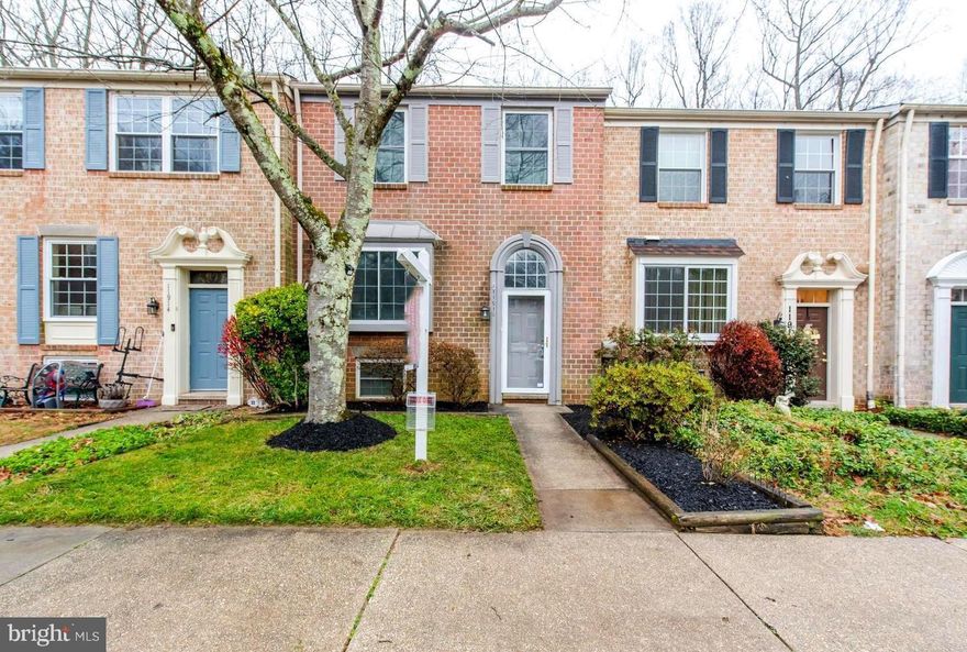 Upgraded brick townhome is move-in ready!  Kitchen boasts granite counters, stainless steel appliances, and freshly painted cabinets.  Open living room hosts a wood burning fireplace with tile surround and sliding glass doors leading the the deck which backs to a wall of trees for privacy. 3 bedrooms upstairs including the primary bedroom with full bath. Lower level offers a family room with wood burning fireplace, sliders to the patio and backyard, and a bonus room, perfect for guests or for working from home! 1 reserved parking spot.