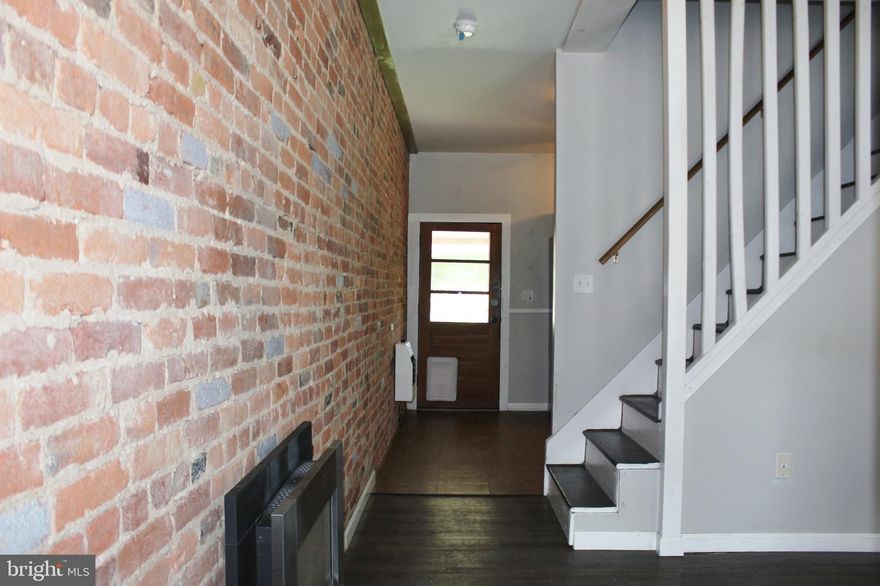 Adorable home!  On the first floor is the living room with gas fireplace and picture window looking out to the neighborhood and large kitchen with room for a table. Off the kitchen is a deck the leads to your fenced backyard and private parking area.  Up the first flight of stairs is one bedroom, closet and a full bathroom. Up the second set of stairs you will find the attic which has been finished and can be used as a bedroom, office, workout area, whatever suites your needs!