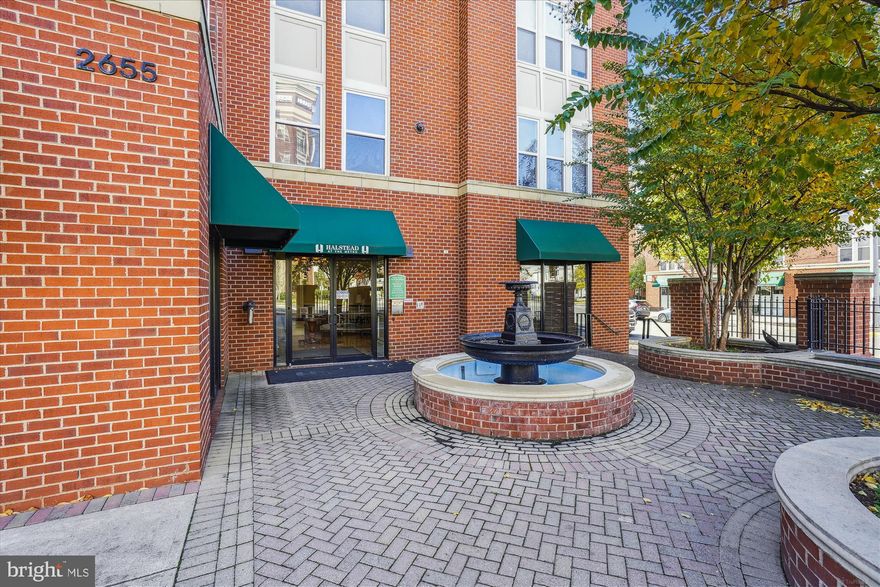 Welcome to 2665 Prosperity Ave Unit 410! This desirable top-floor unit with a balcony in Halstead at the Metro is a rare find, complete with in-unit laundry and TWO garage parking spaces.

This move-in-ready home has been freshly painted and features a smart floorplan that lives large. The bright living and dining room area includes a cozy fireplace and access to a lovely balcony overlooking the pool and courtyard. The kitchen is equipped with granite countertops, stainless steel appliances, and convenient bar seating. The spacious bedroom boasts a large walk-in closet.

The location is excellent—directly across from the Dunn Loring Orange Line Metro Station. You'll enjoy an assortment of restaurants and convenient shops, plus the Mosaic District, which includes the Angelika Theatre, True Food, Target, and MOM's Organic Market.

Halstead amenities include 24-hour front desk support, outdoor pool, well equipped gym, indoor basketball/sport court, a business center, a party/club room, assigned garage parking, and secured access.