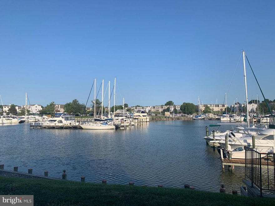 WATERFRONT with Amazing Marina Views and SPECTACULAR SUNSETS! 3BR 2.5BA Condo with Renovated Kitchen and LARGE Bedrooms!  Main level Patio and upper deck to maximize the views! Queens Landing has so many enjoyable amenities such as tennis courts, swimming pool, gym, racquet ball, party room and grilling deck. Super close to the Kent Island Trail!